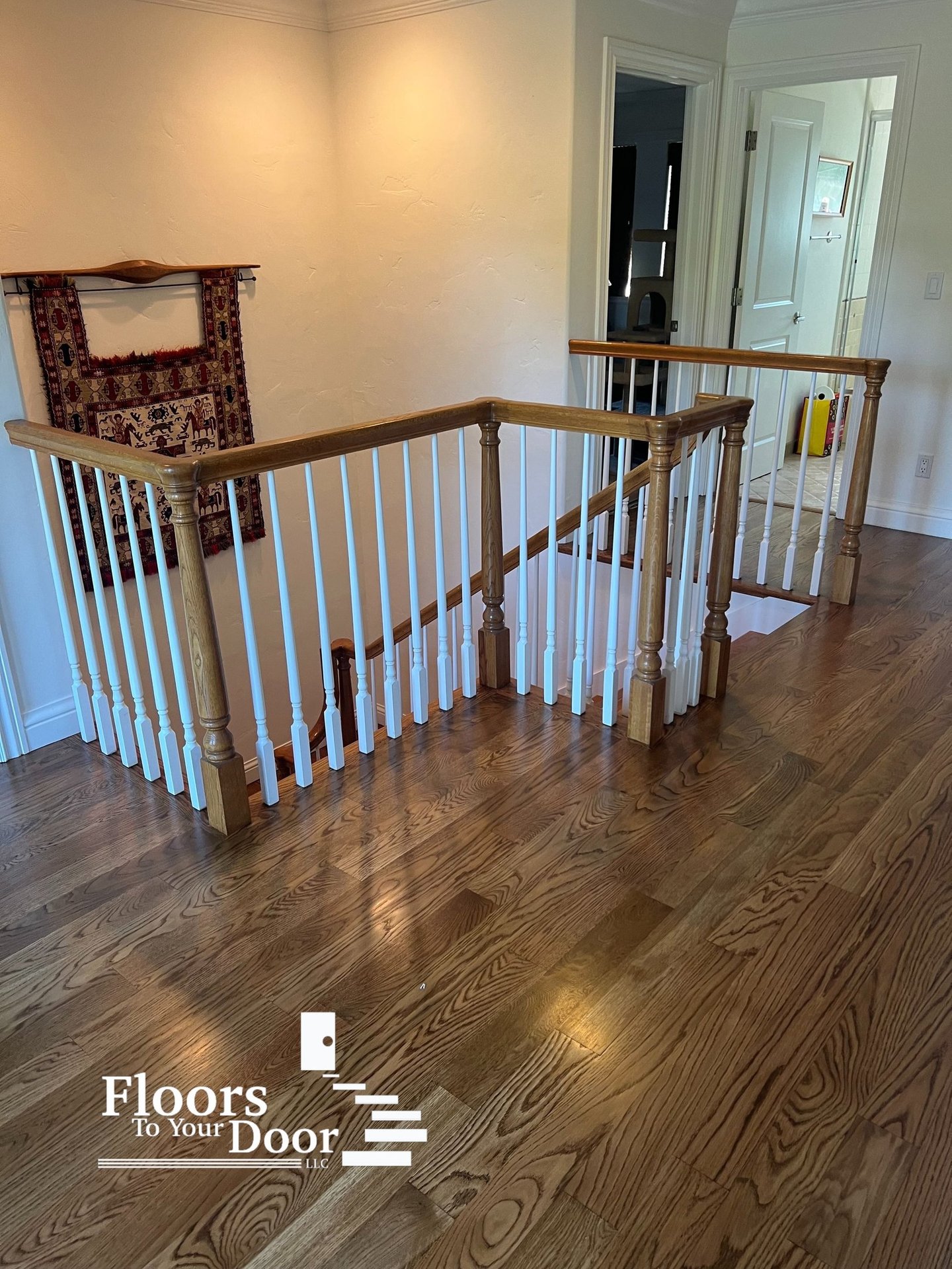 a staircase way with a Hardwood floor and a stair case