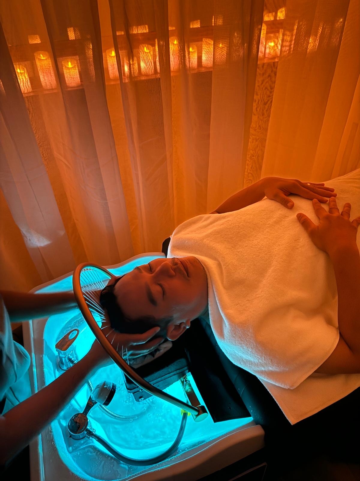 a man is getting a massage at a spa