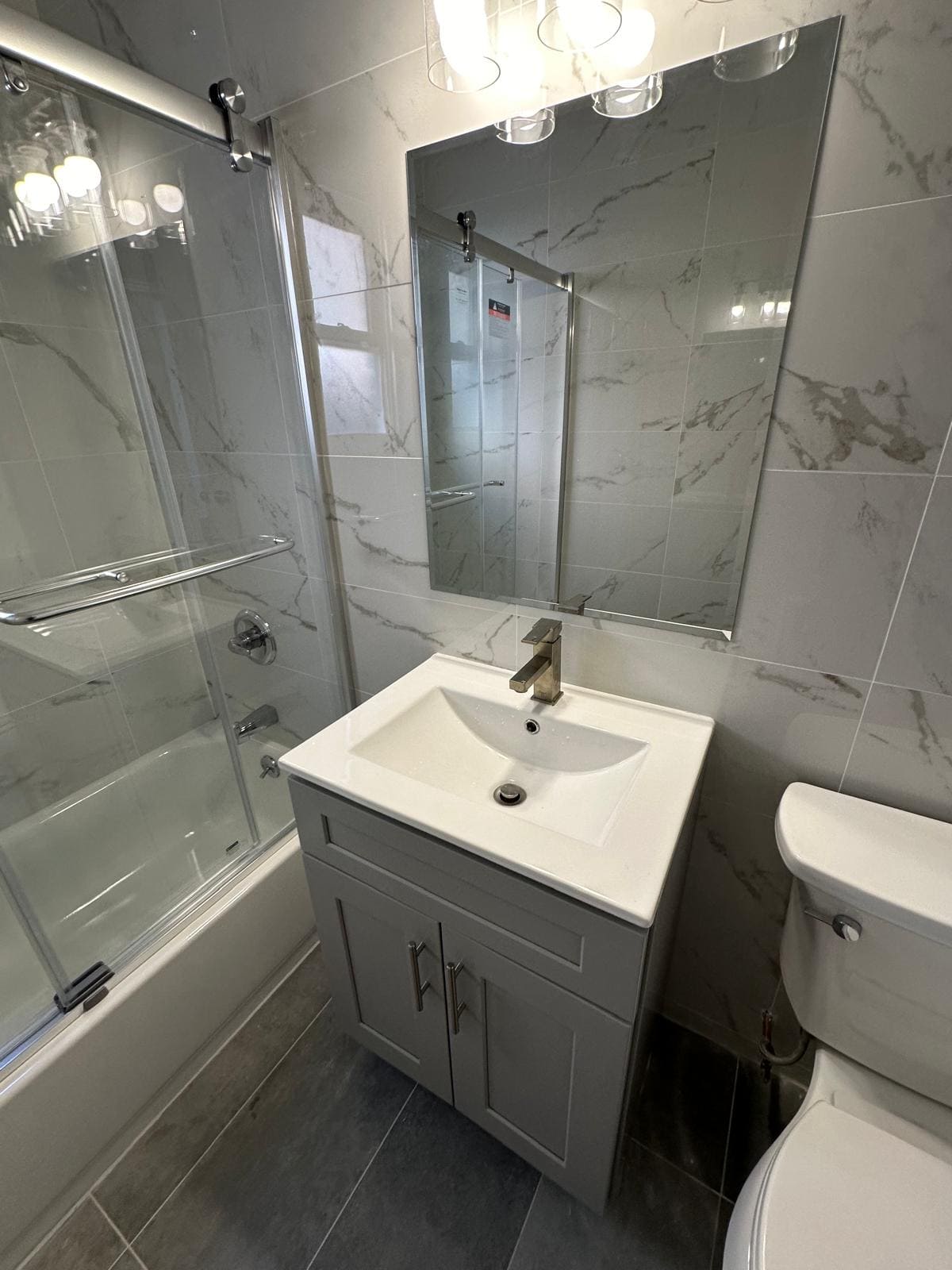 a bathroom with a sink and a shower