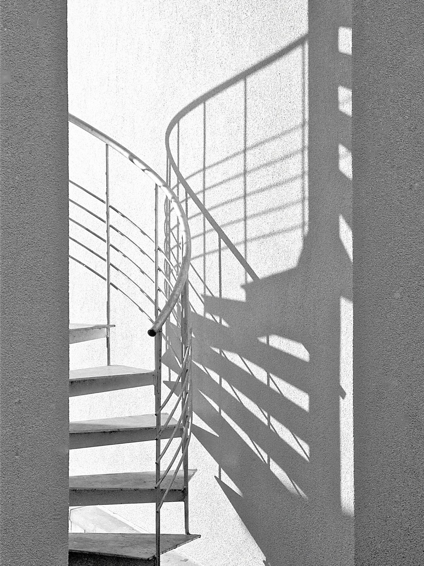 a spiral staircase with guardrails