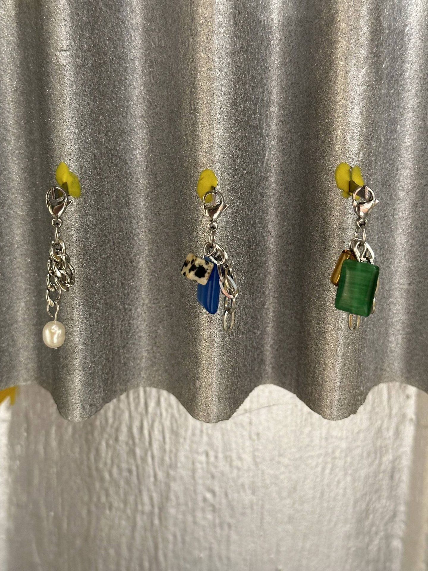 Three fun.arc.ik. necklace charms with pearls, blue stone, Dalmatian jasper, and green stone