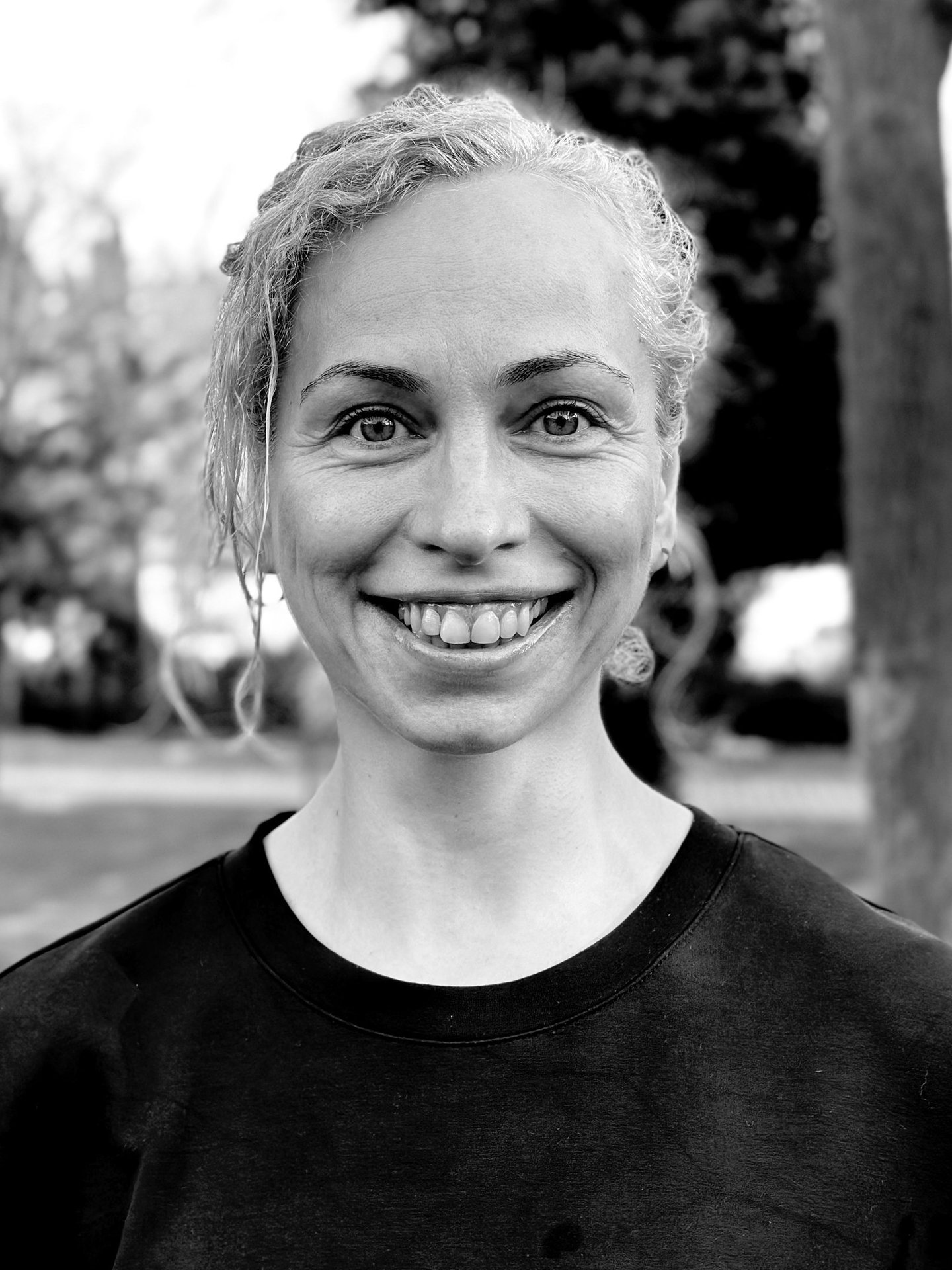 Nihan Gencer, Tai Ji and Qi Gong instructor at WDP Türkiye, smiling outdoors in natural light.