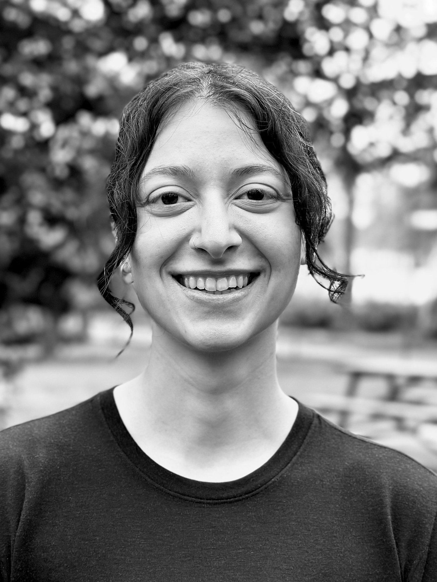 Zeyneb Önsiper Tai Ji Qi Gong instructor of WDP Turkey, smiling outdoors in black shirt
