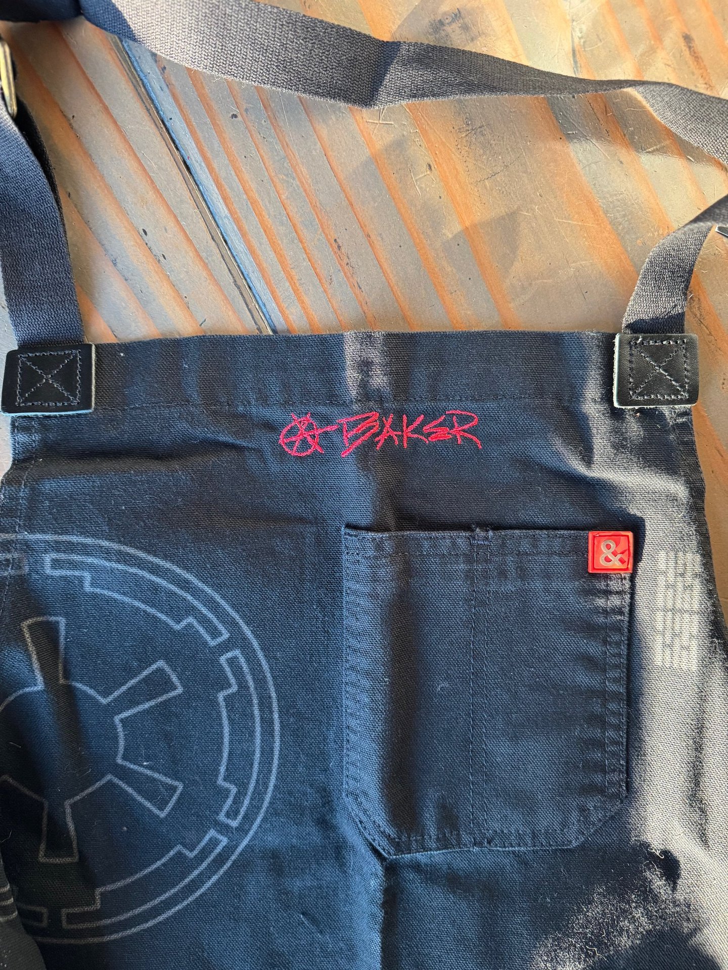 an apron with handwriting embroidered on it
