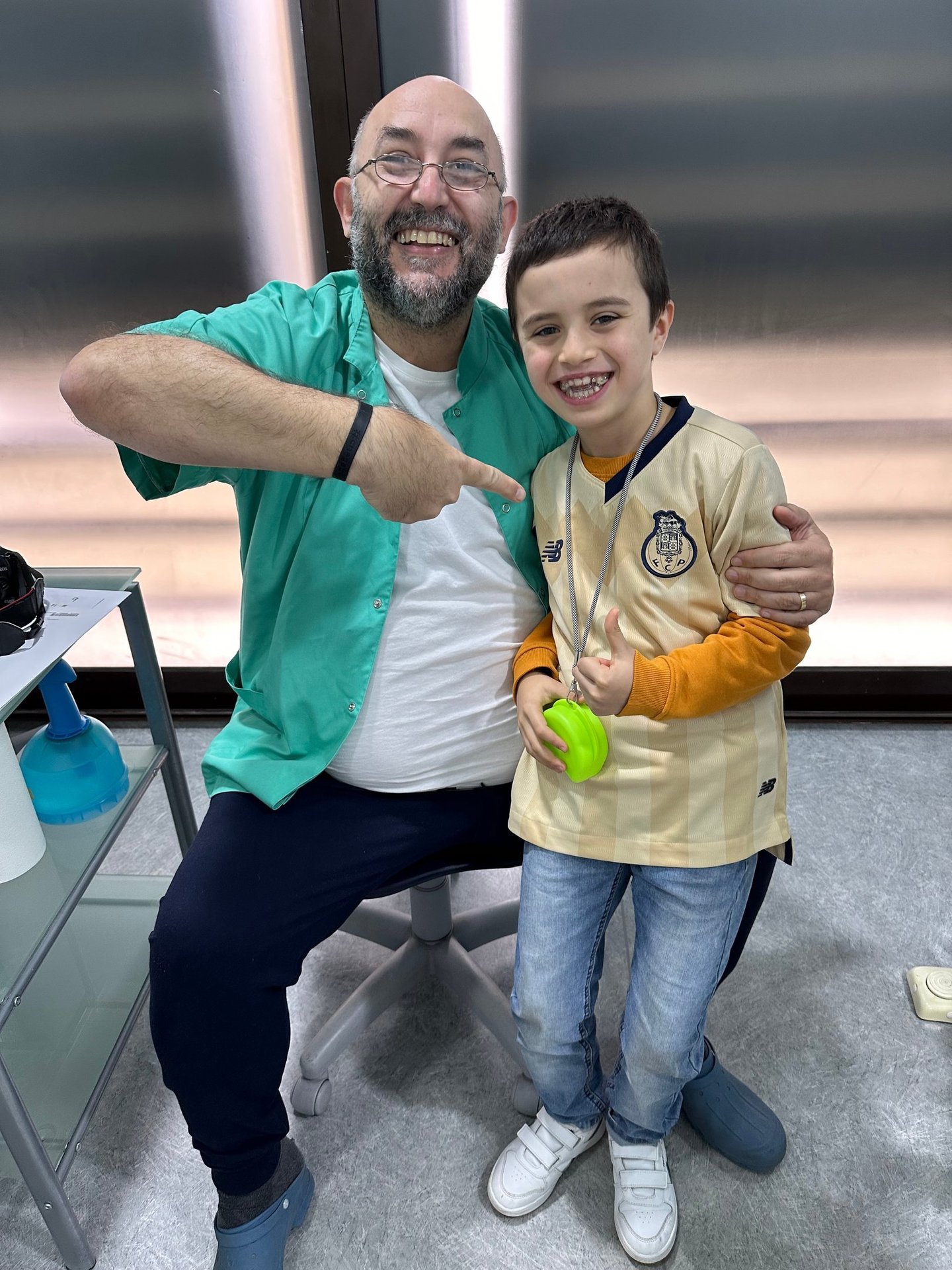 a man and a boy are posing for a picture
