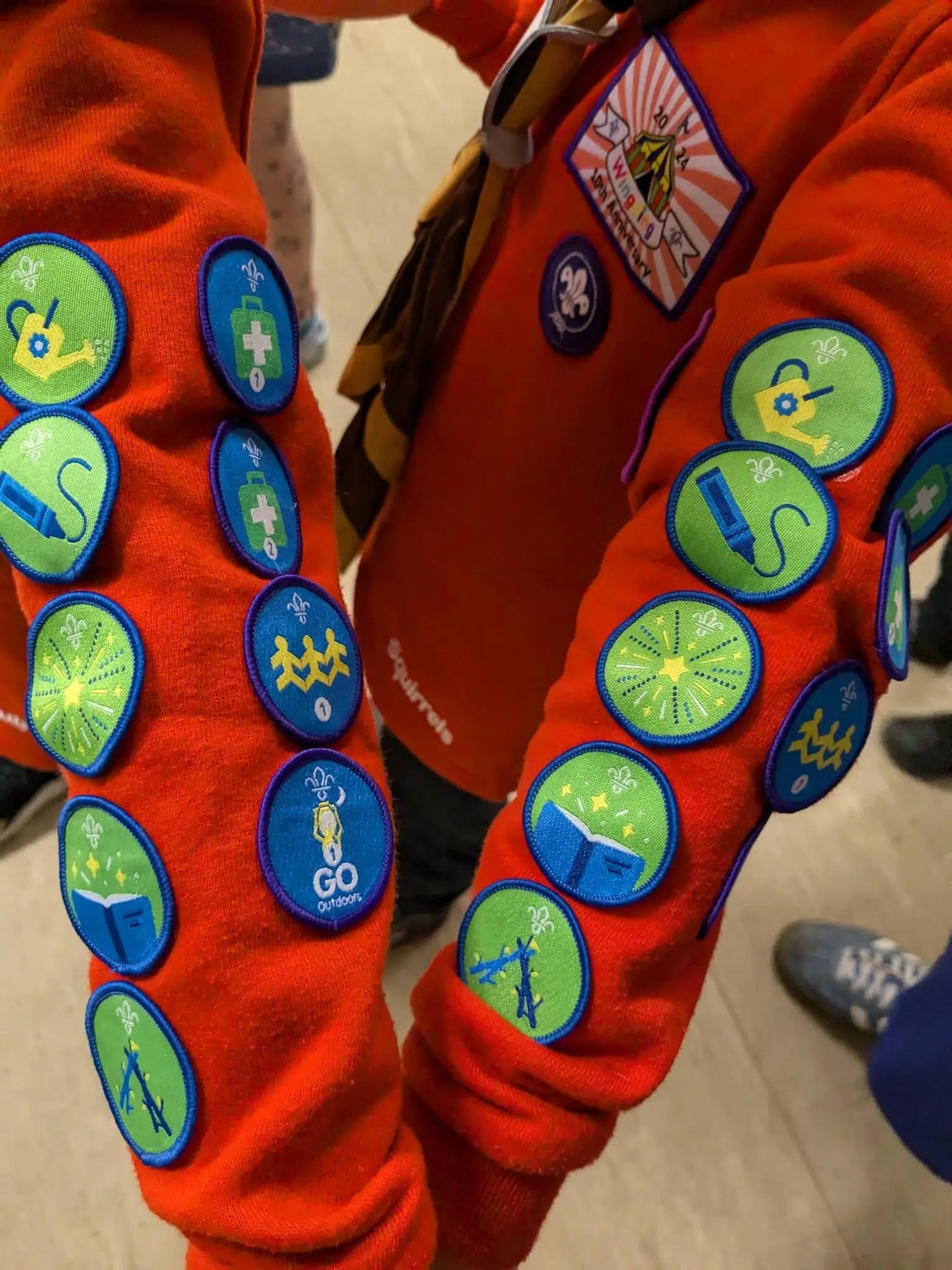 Two Squirrels show their many badges from the 25th Allerton Scout group