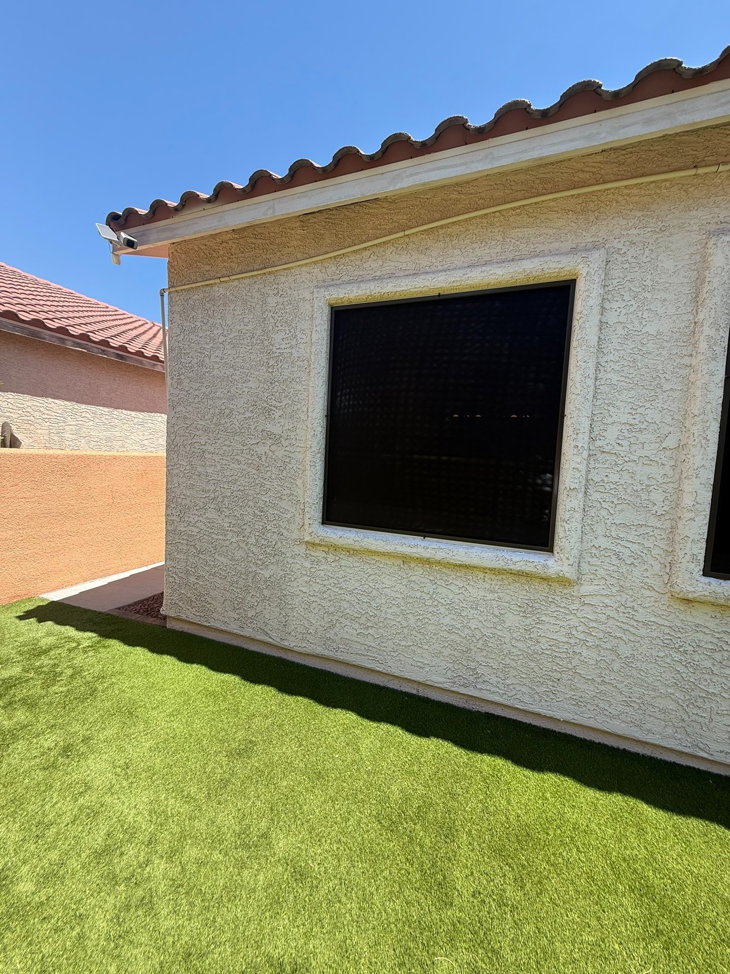 Solar screen blocking view into a house