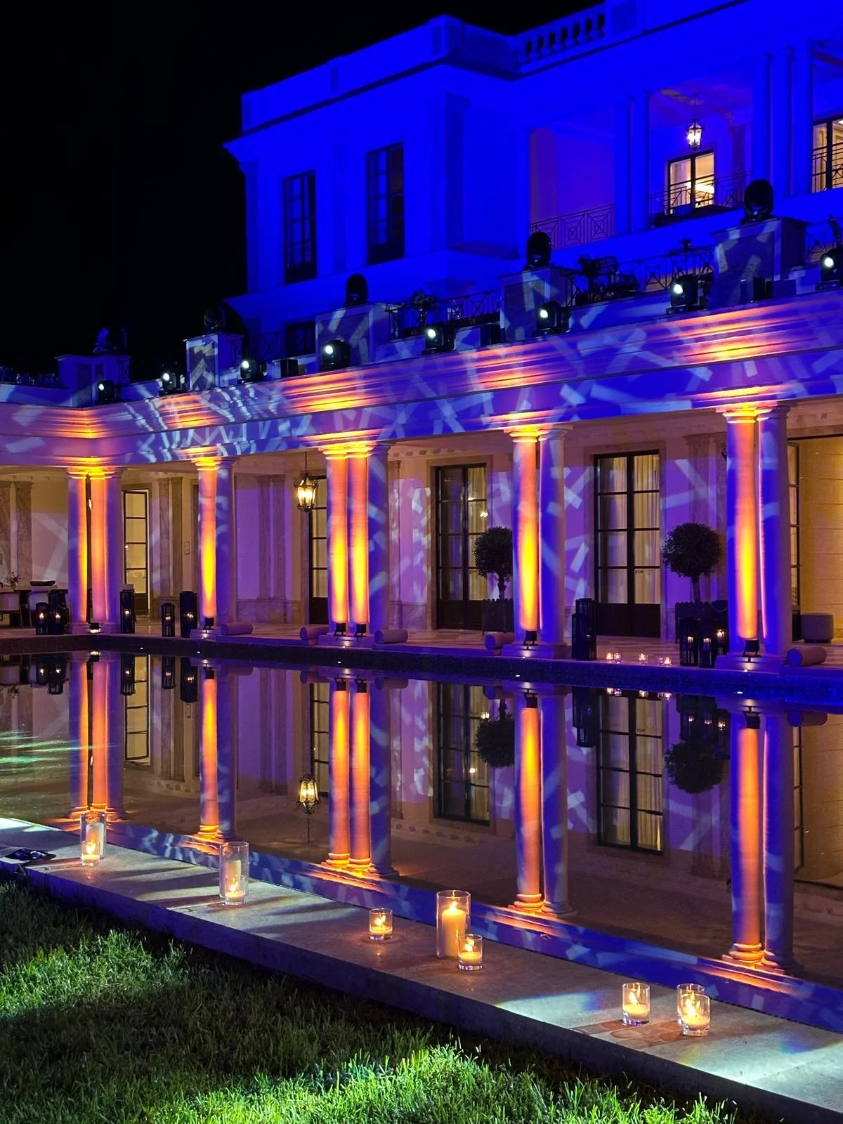 Poolside gala event with blue evening lighting