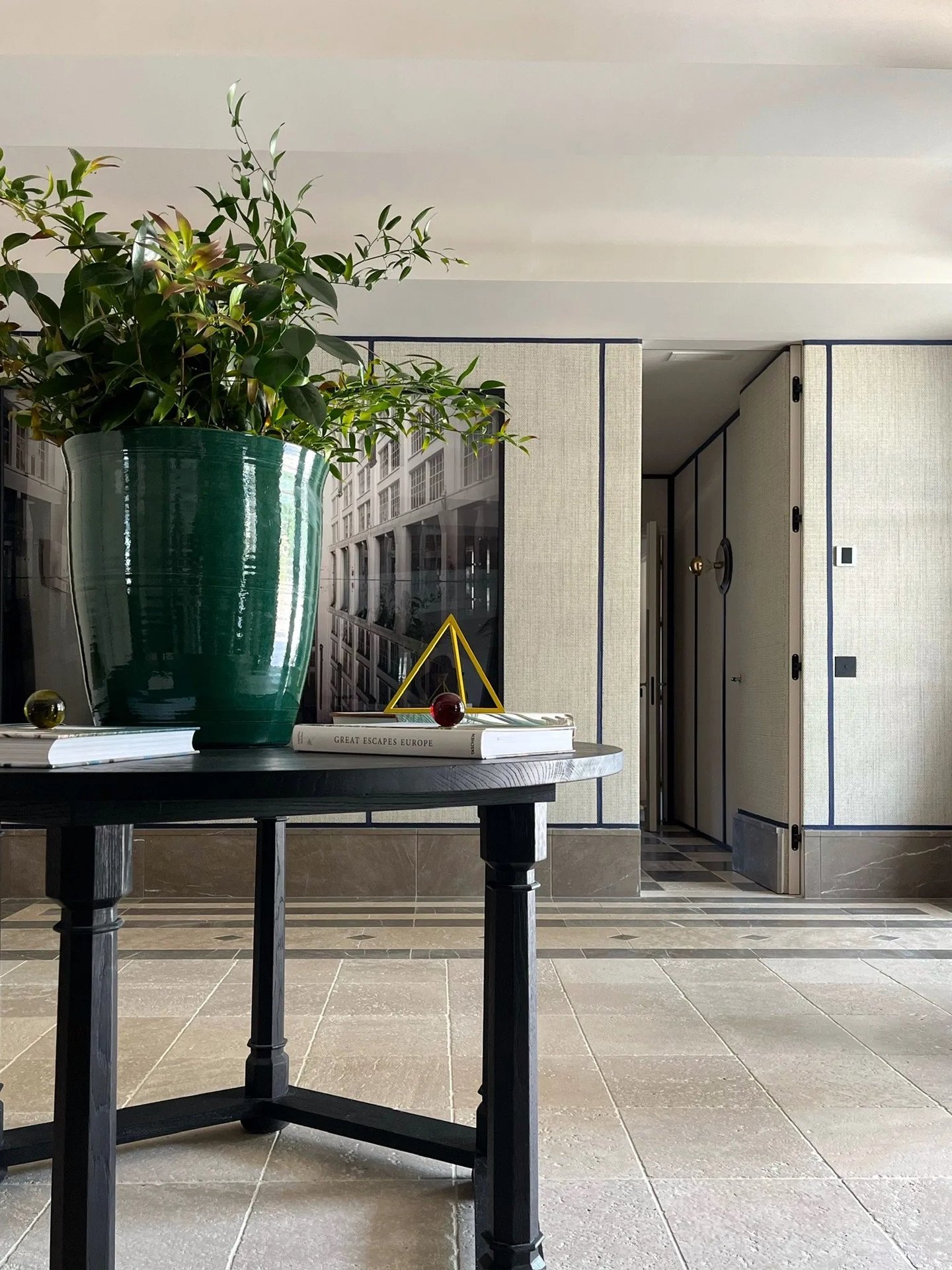 Entrance foyer at Villa La Gratitud with sculptural console and fresh florals