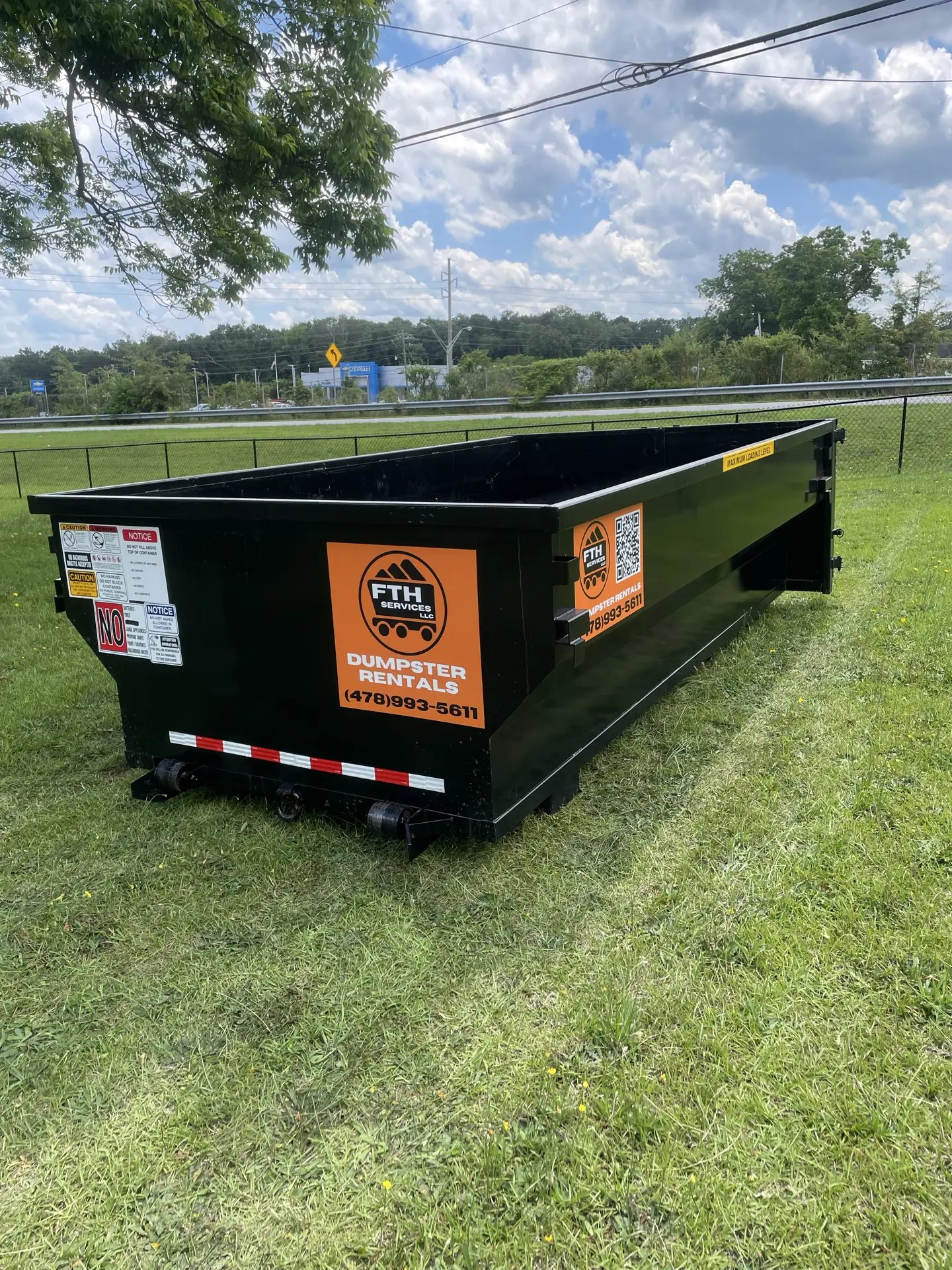 Dumpster rental in Forsyth, GA — roll-off placed in residential yard