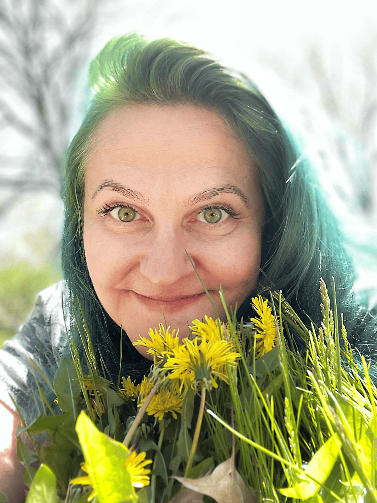 a woman with green hair and yellow flowers