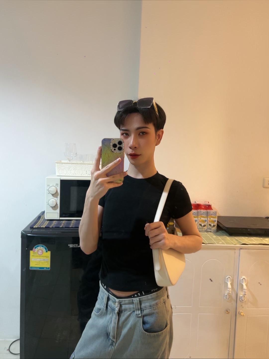 Massage therapist taking selfie at his kitchen in Pattaya