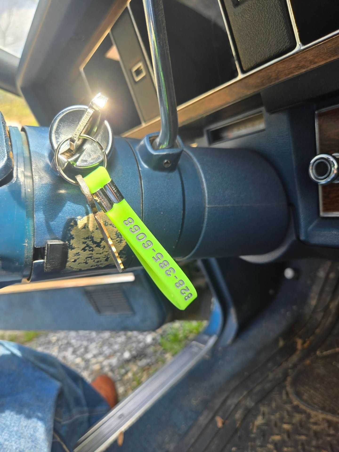 Keys with a green key tag in a classic car ignition