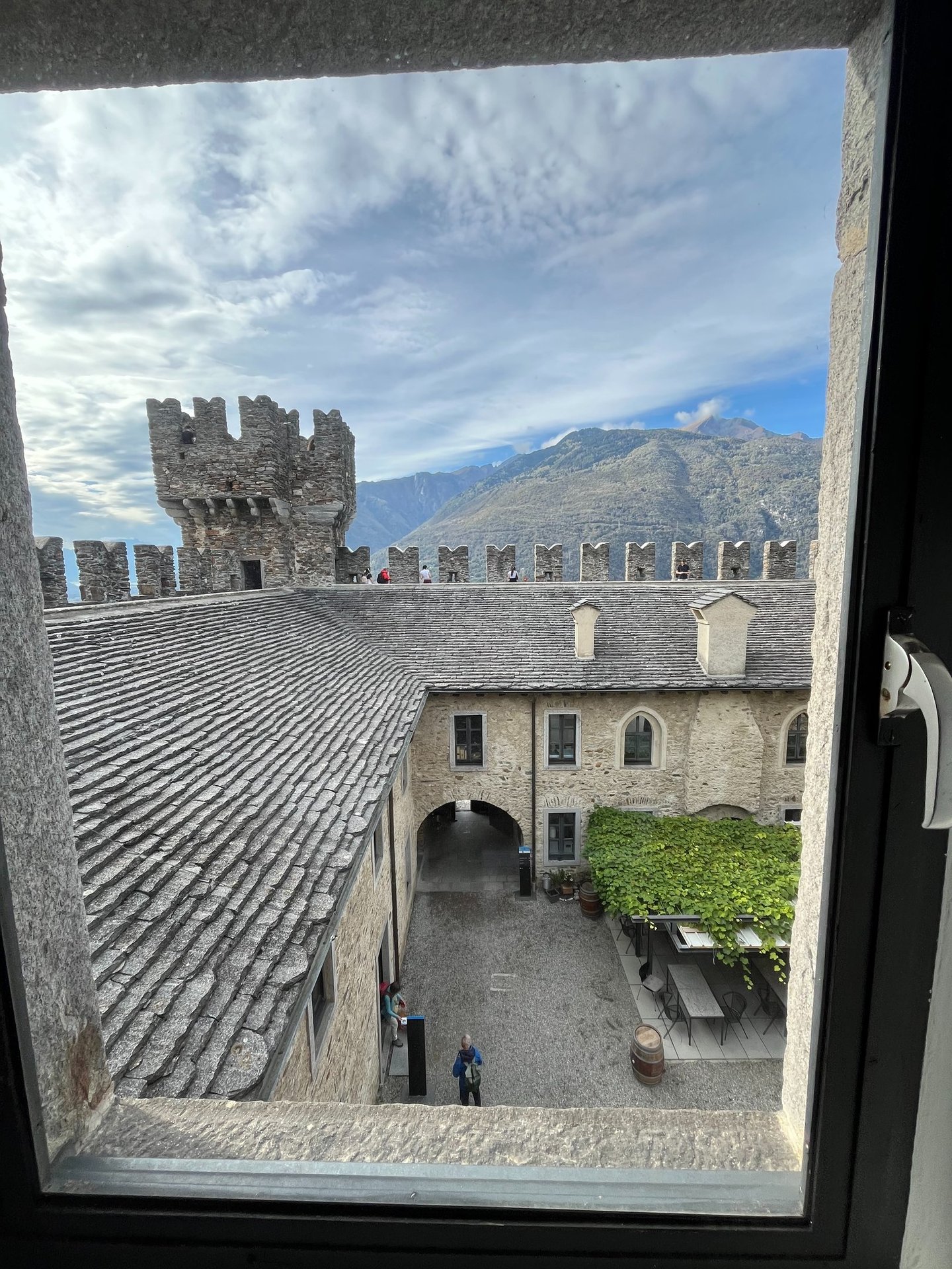 Looking out a window at the inner courtyard of Sasso Corbado