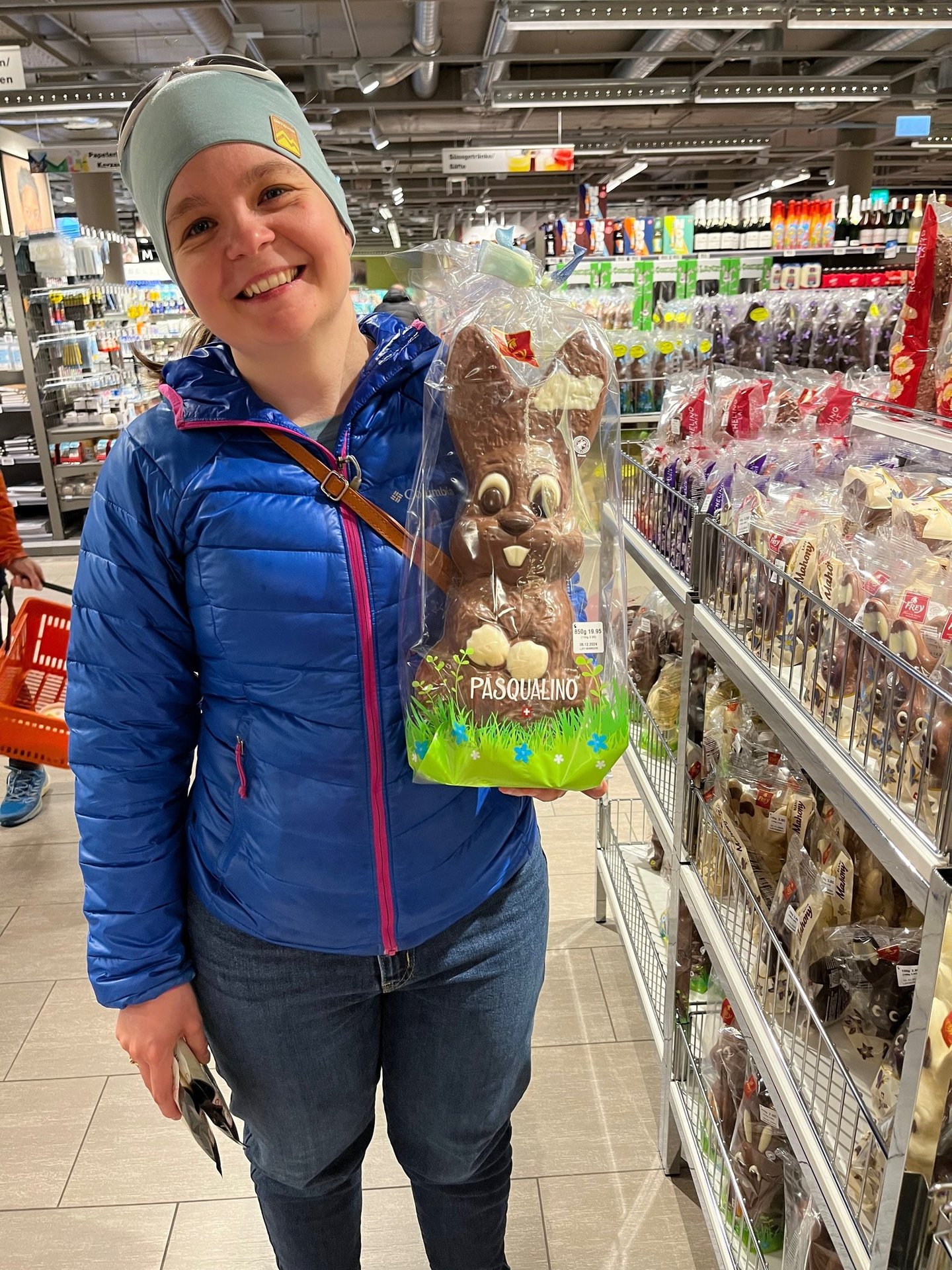 Picture of Corinne from Hidden Switzerland Travel holding a chocolate easter bunny