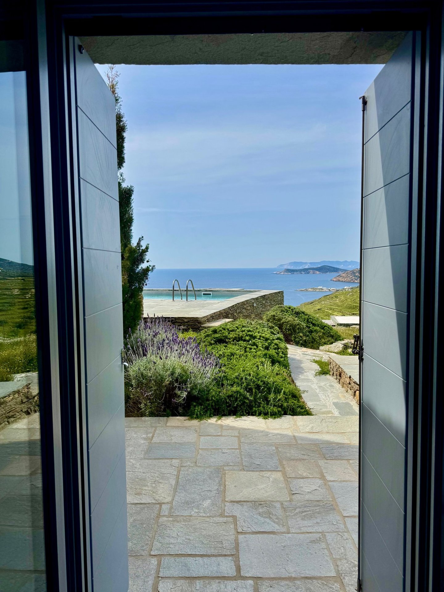 View out of one of the bedrooms over the pool onto the sea