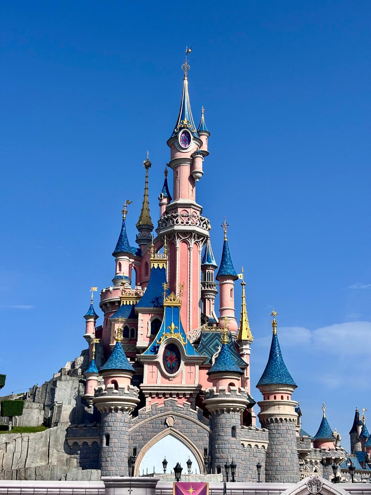 Mother and daughter visiting Disneyland Paris castle