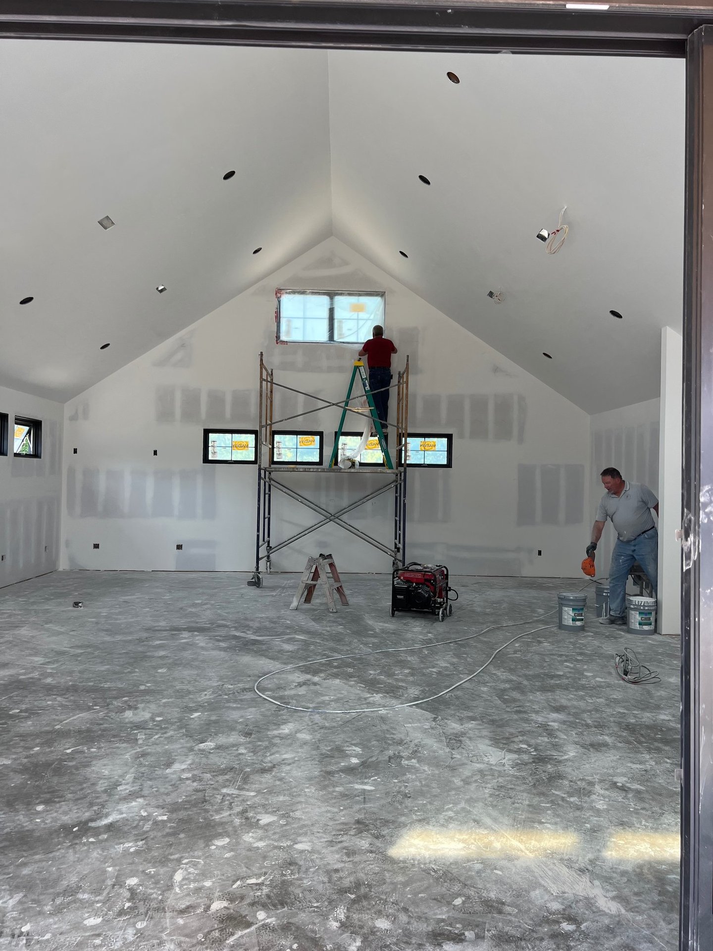 C&B Drywall crew mudding & taping at residential home