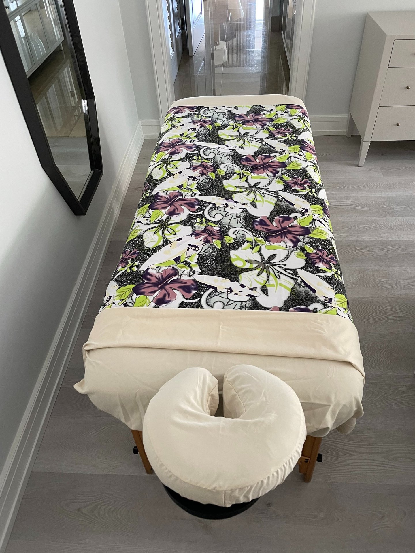 a massages by sophia massage table with a large floral print