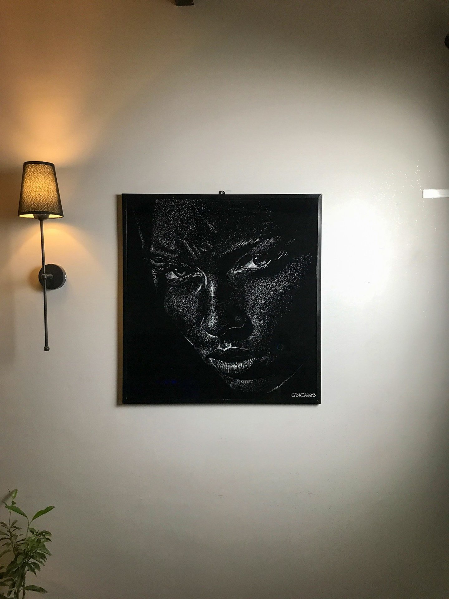 One-of-one broken glass portrait artwork on laminated glass