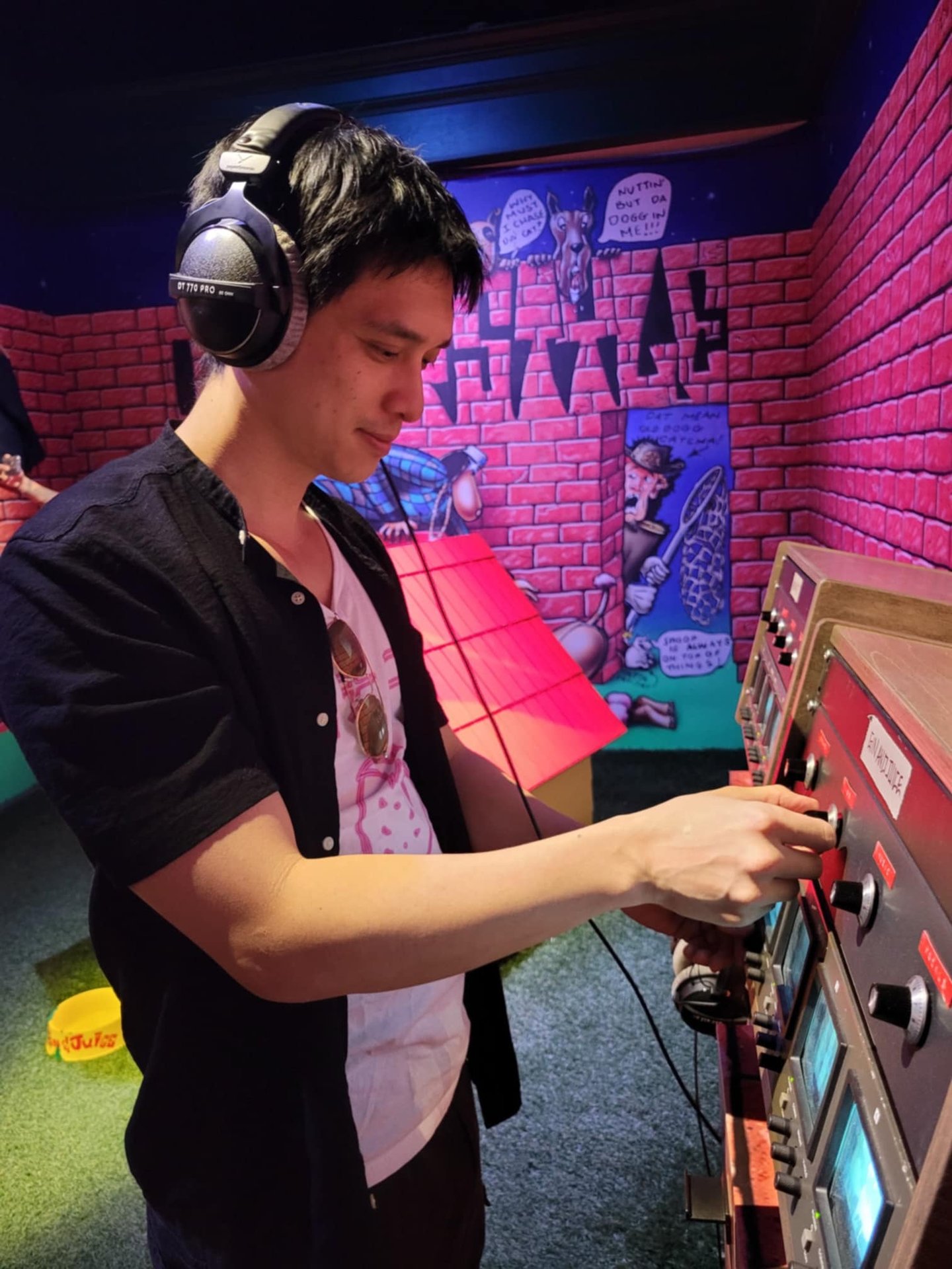 a man in headphones and headphones playing video games