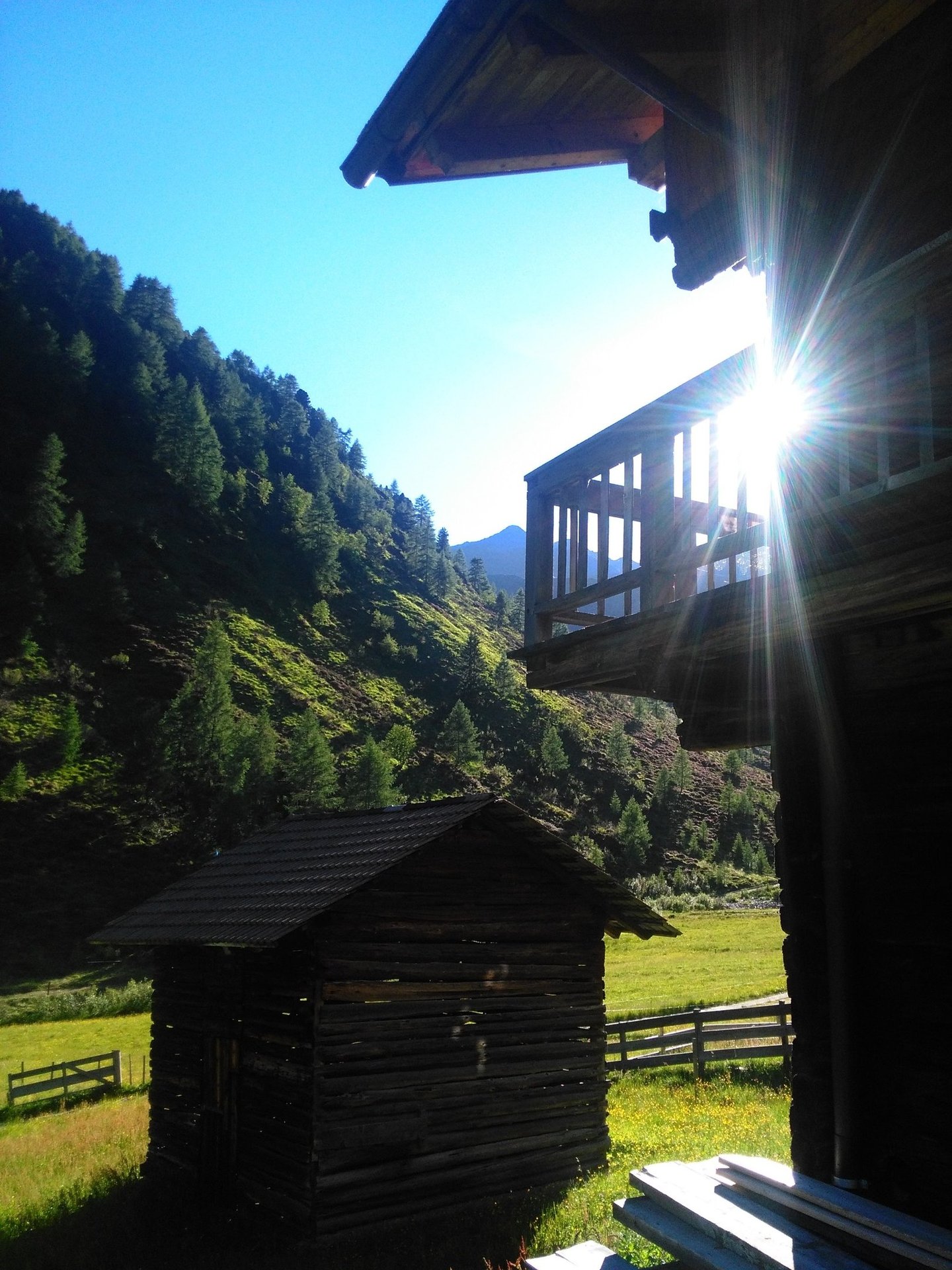 a cabin with a view of a mountain range