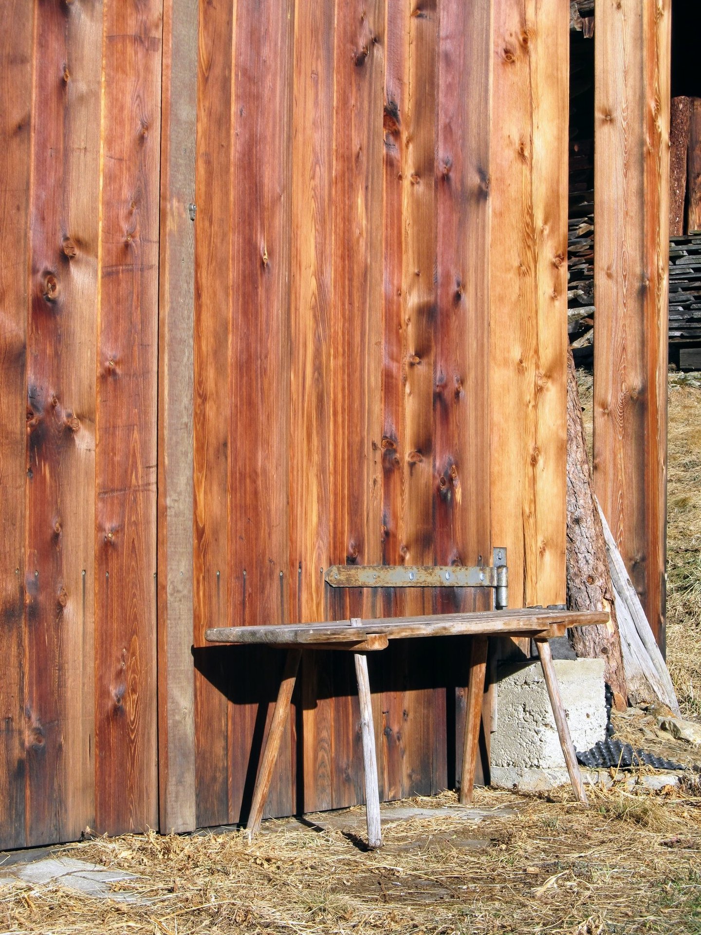 a bench with a bench and a bench with a bench in front of a wooden