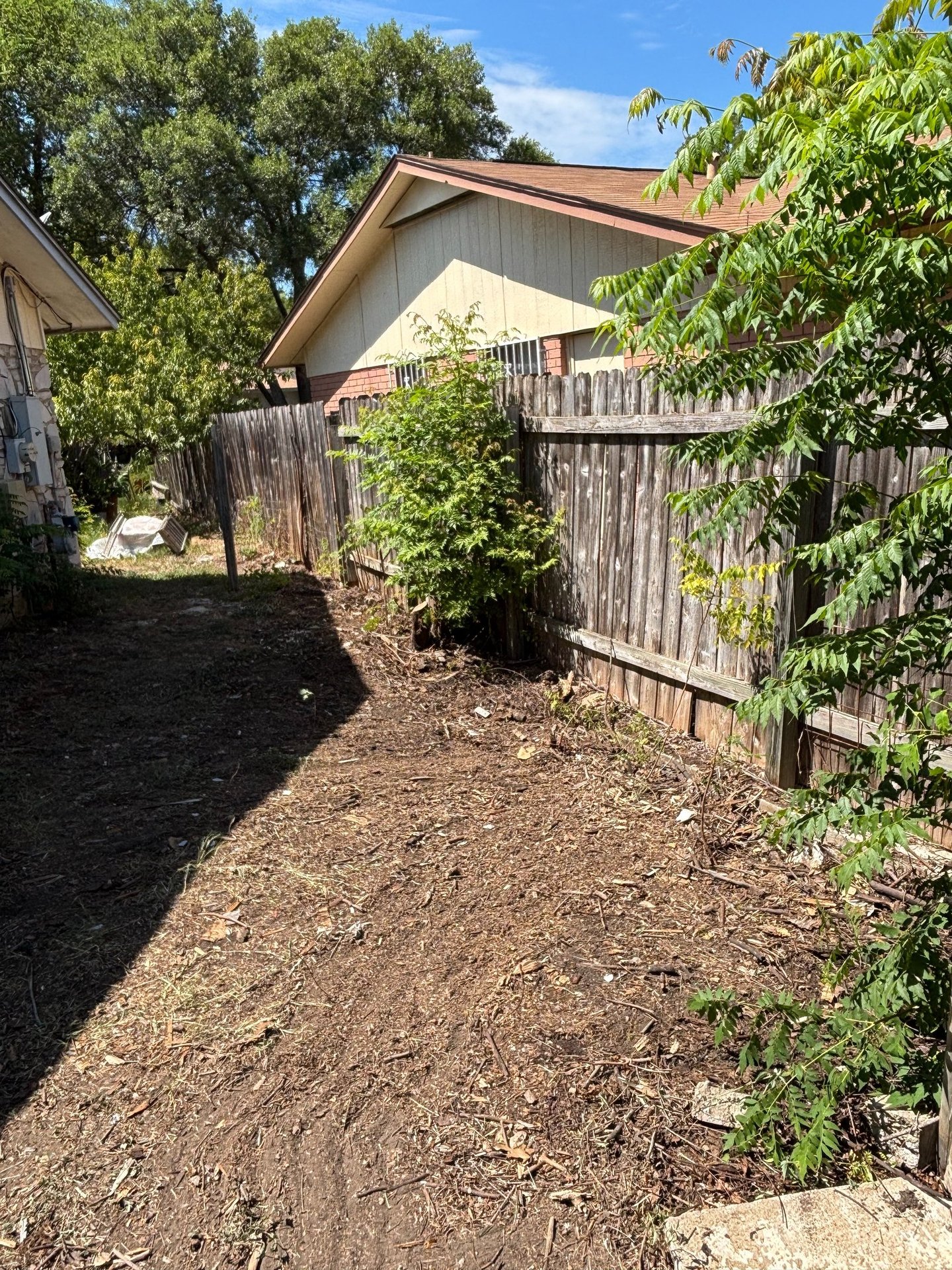 a clean and decluttered backyard after junk removal in fair oaks ranch