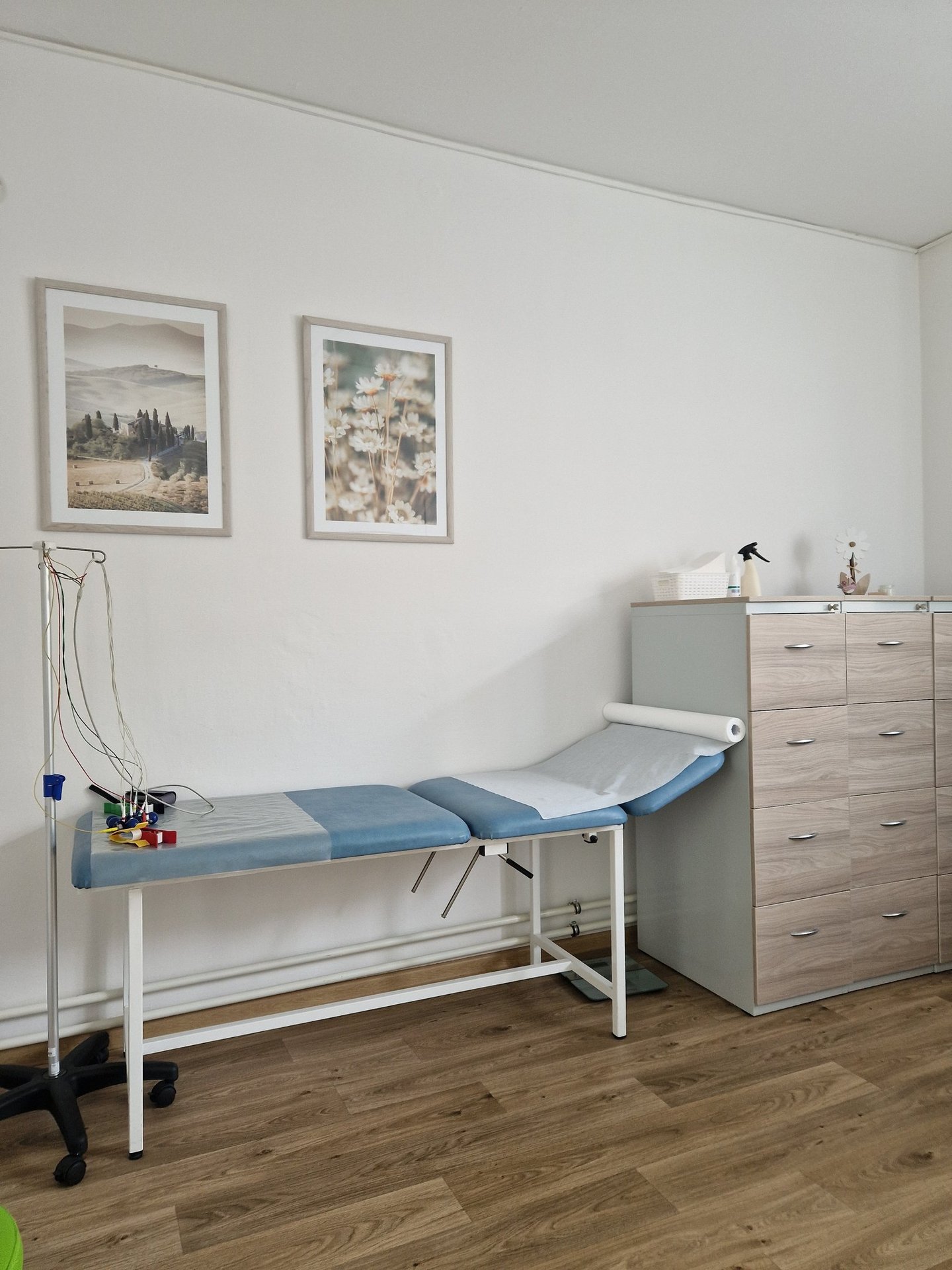 a hospital room with a bed and a desk