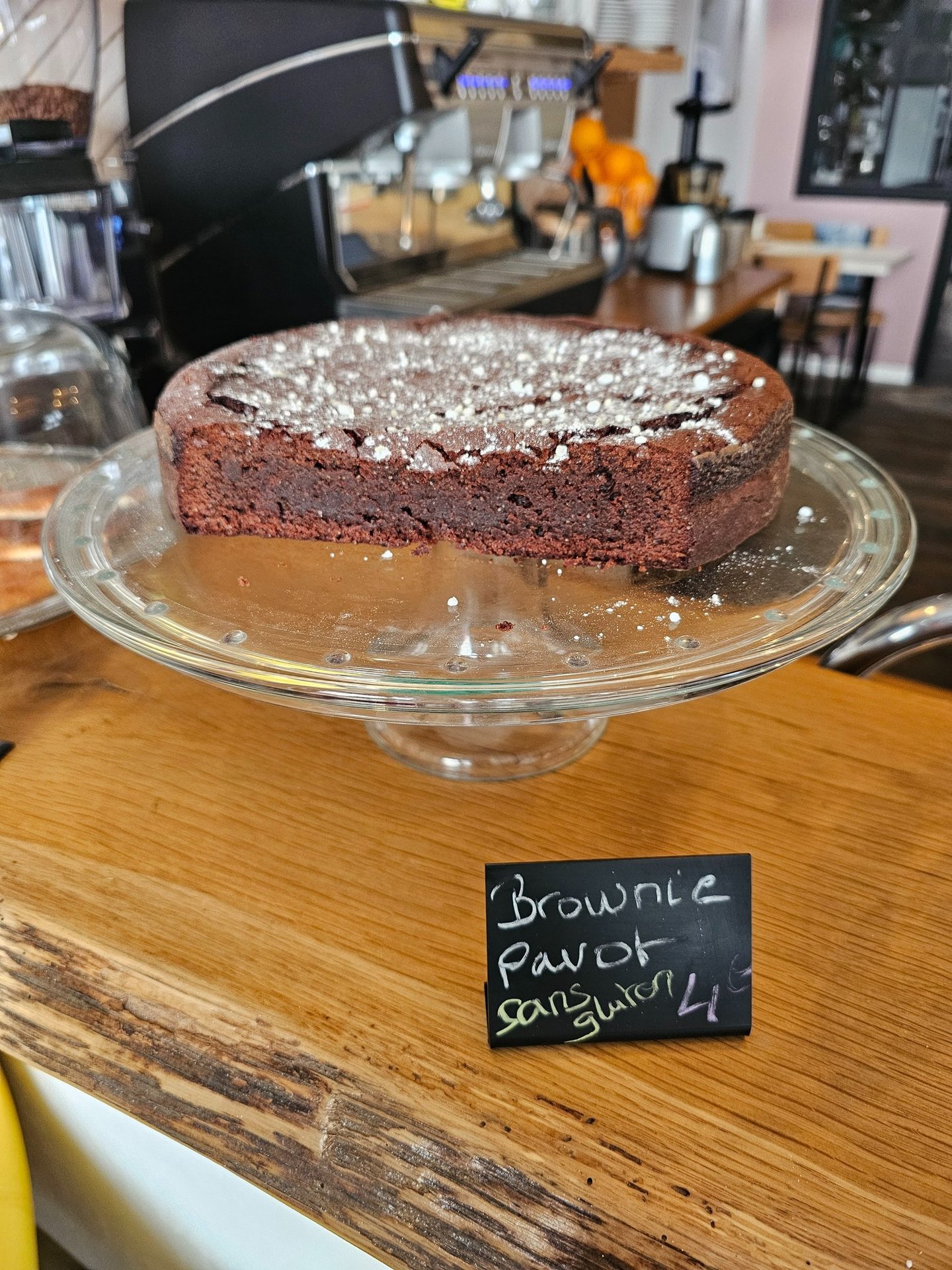 Gluten-free poppy seed brownie dusted with icing sugar