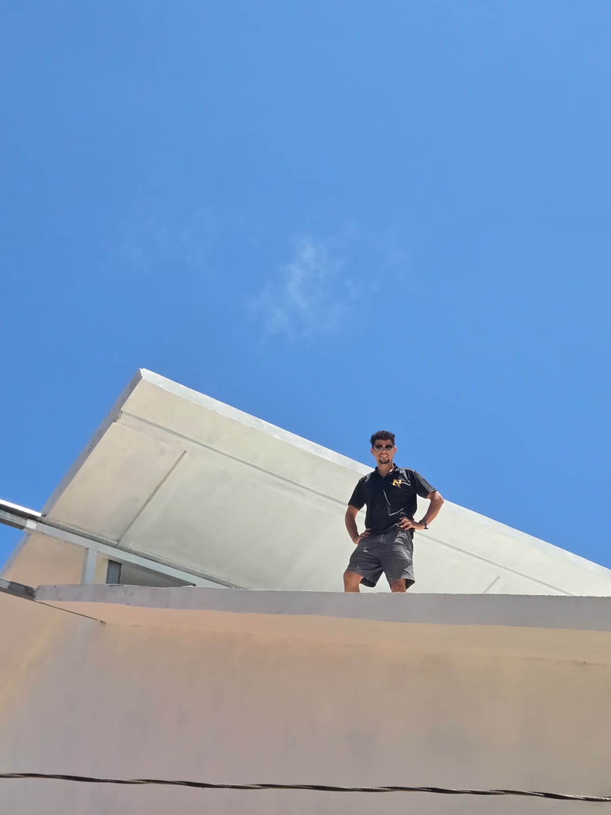 José Ponce, founder of Nance, overseeing construction work on a home roof in Samara, Guanacaste