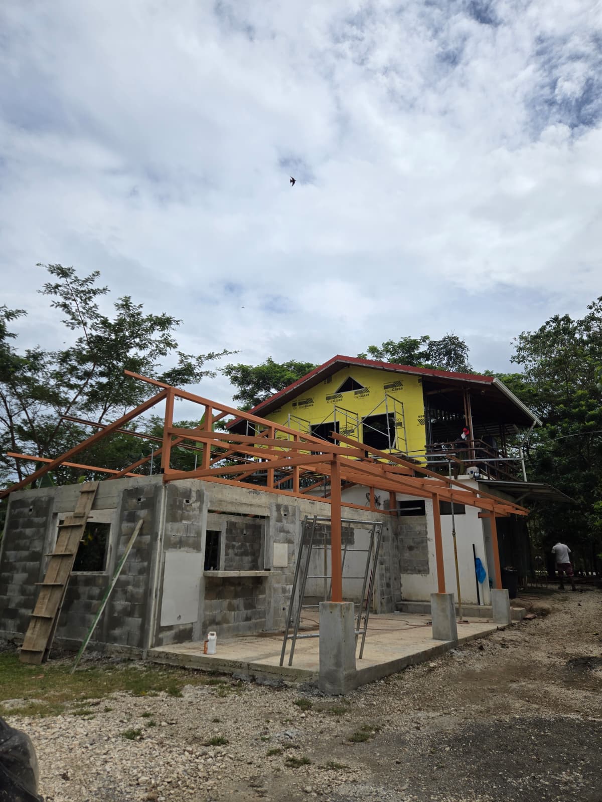 Complete home renovation in progress, steel framing and raw concrete walls