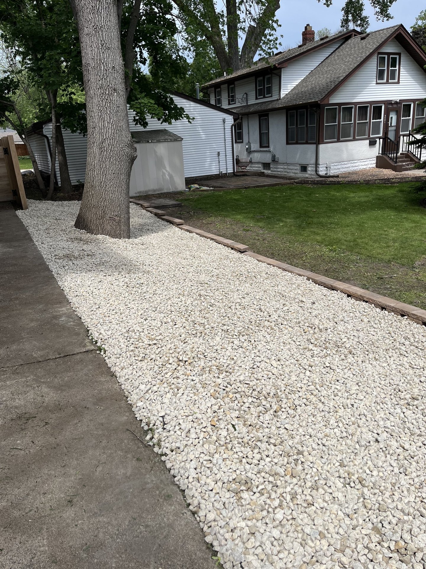 rock landscaping alongside residential driveway in buffalo mn