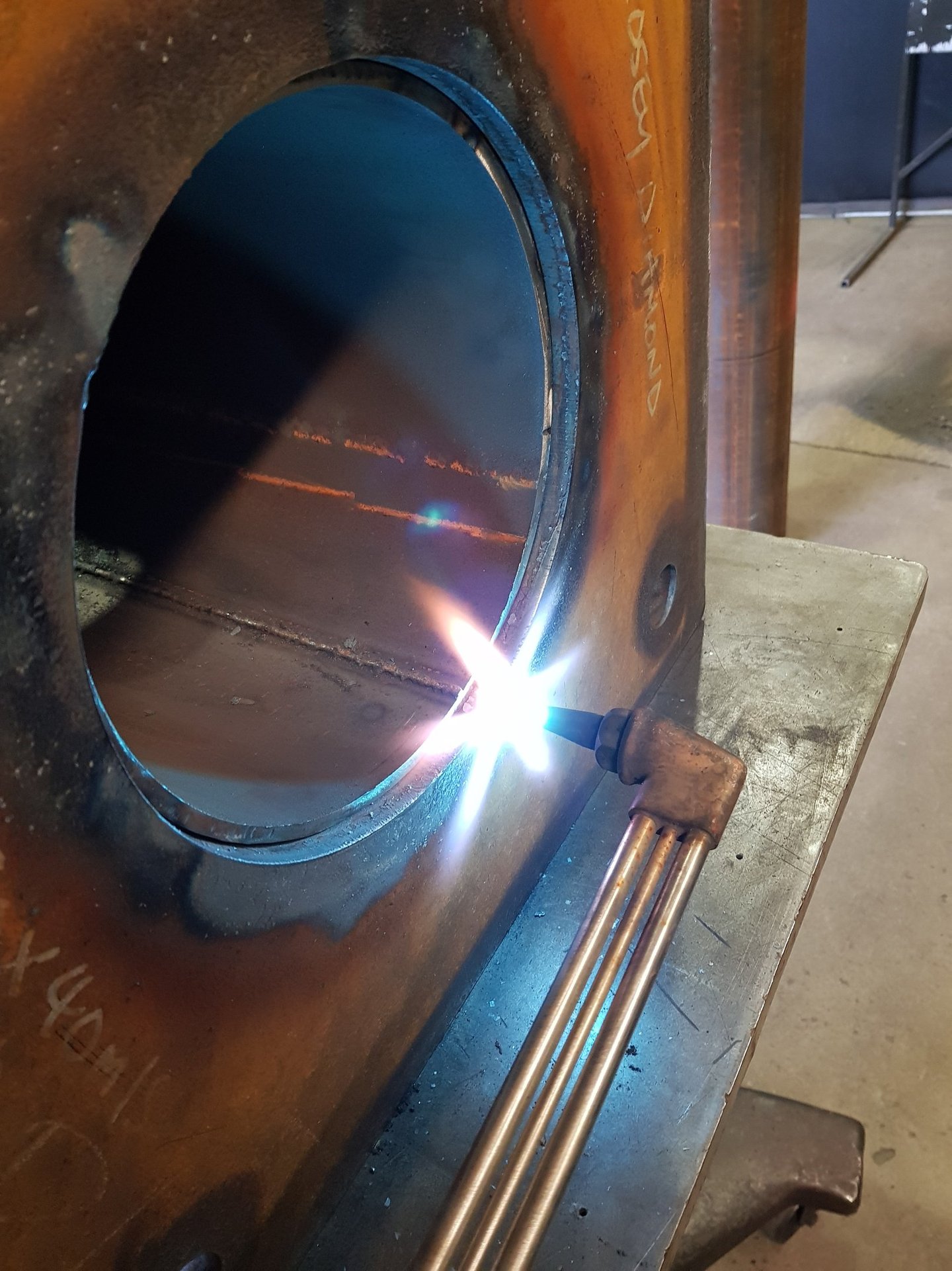 preheating a thick metal base before welding