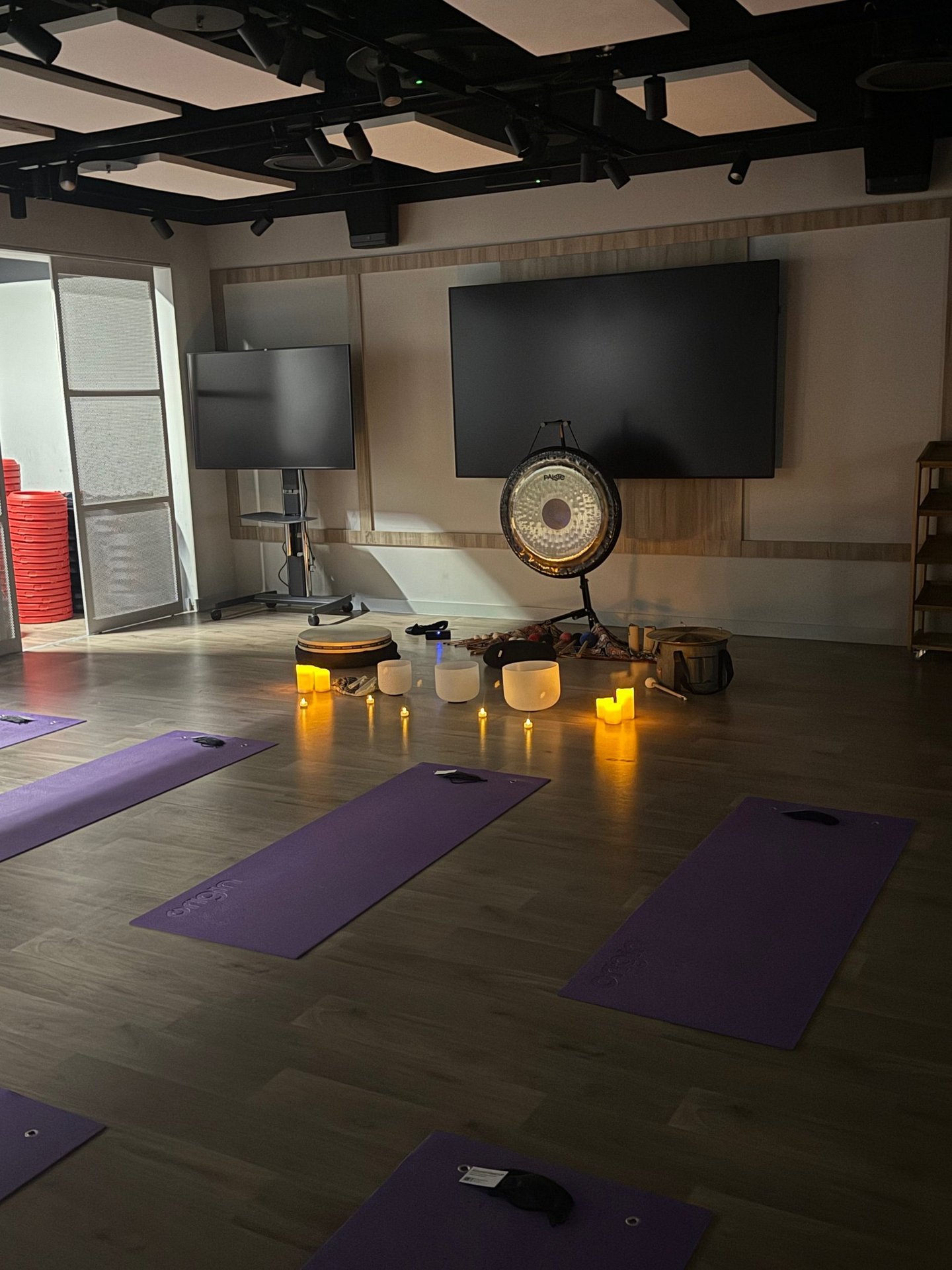 a corporate sound bath set up in an office gym