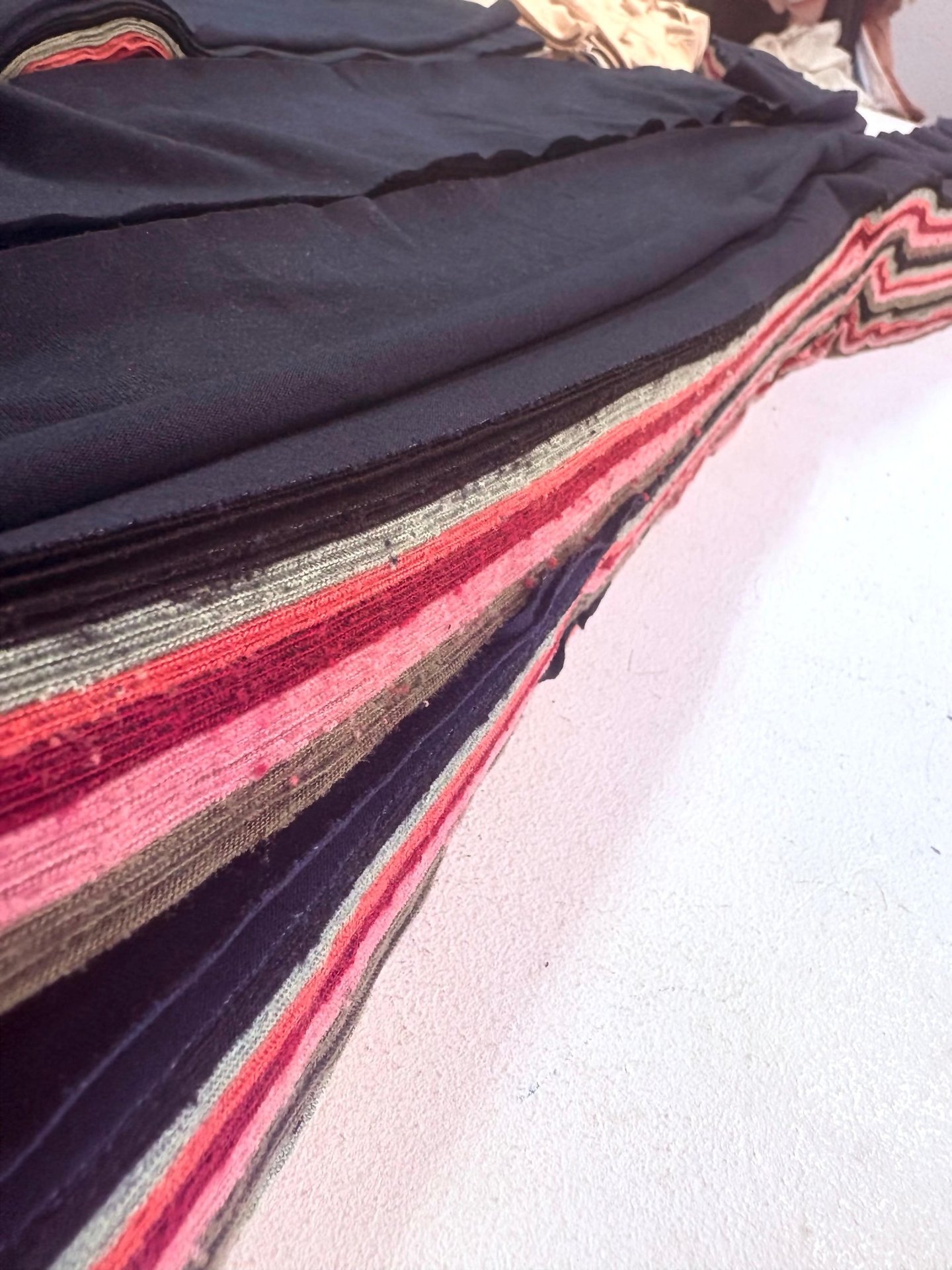 a person holding a piece of clothing with a name on it