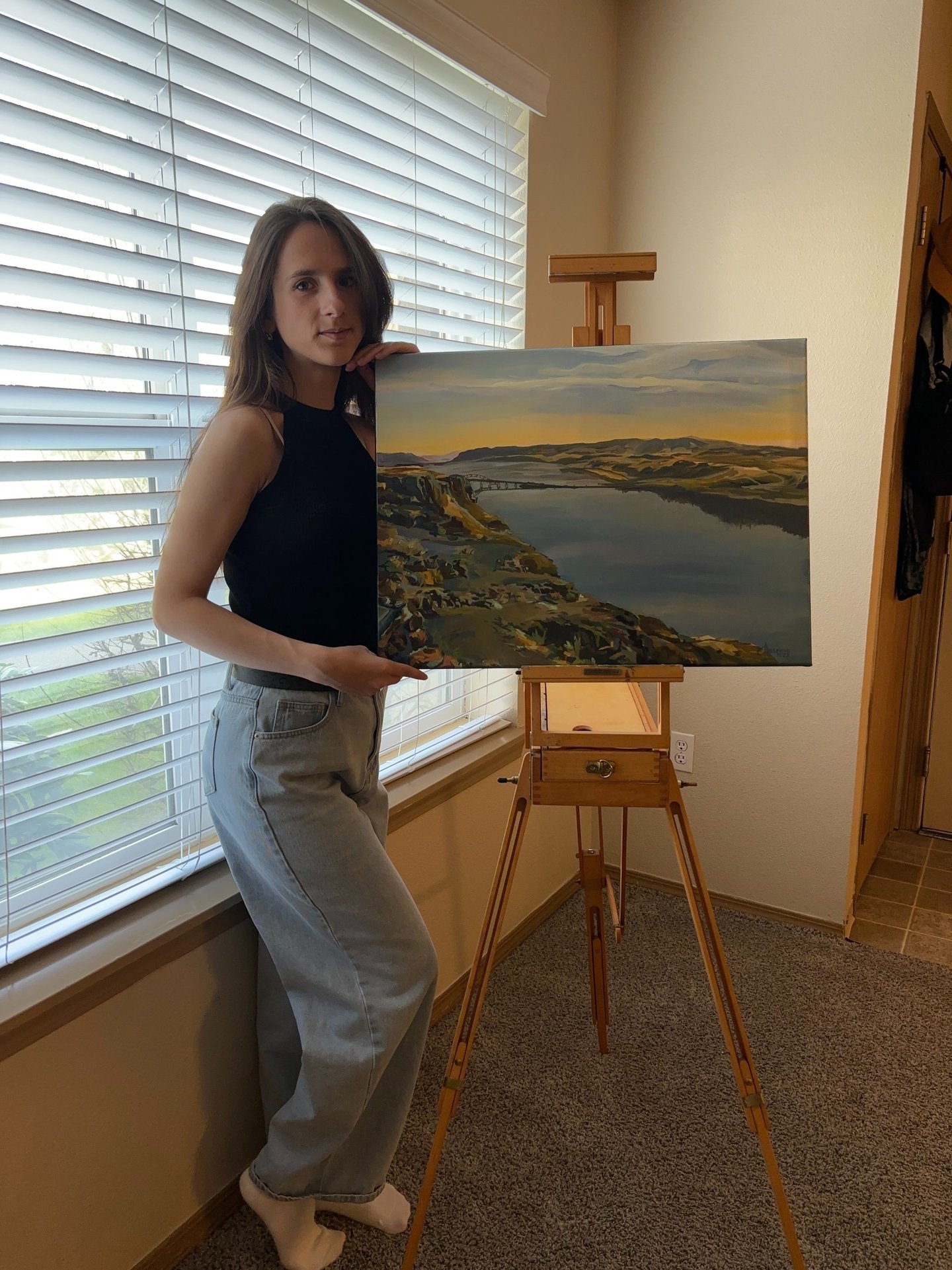Angela Moiseieva with her work 'Reflections of Tranquility' 18х24 inches  the Columbia River