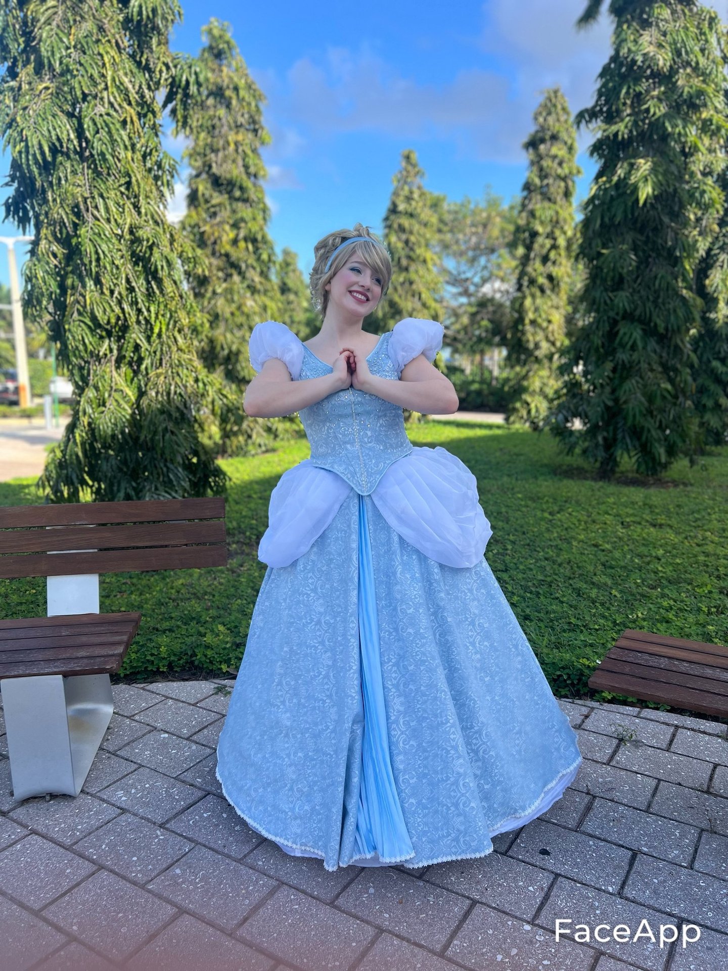 a woman in a blue dress as Cindy