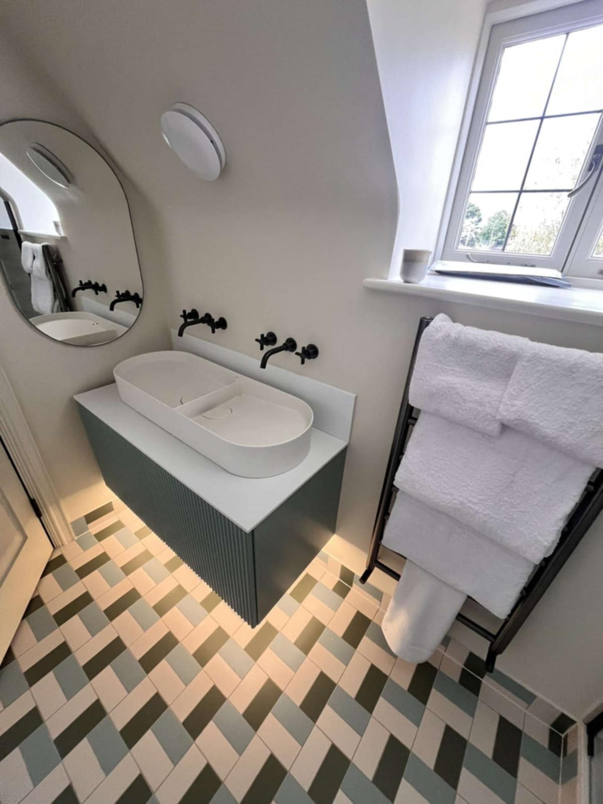 stylish bathroom with double sinks and chrome mixer taps in Evesham