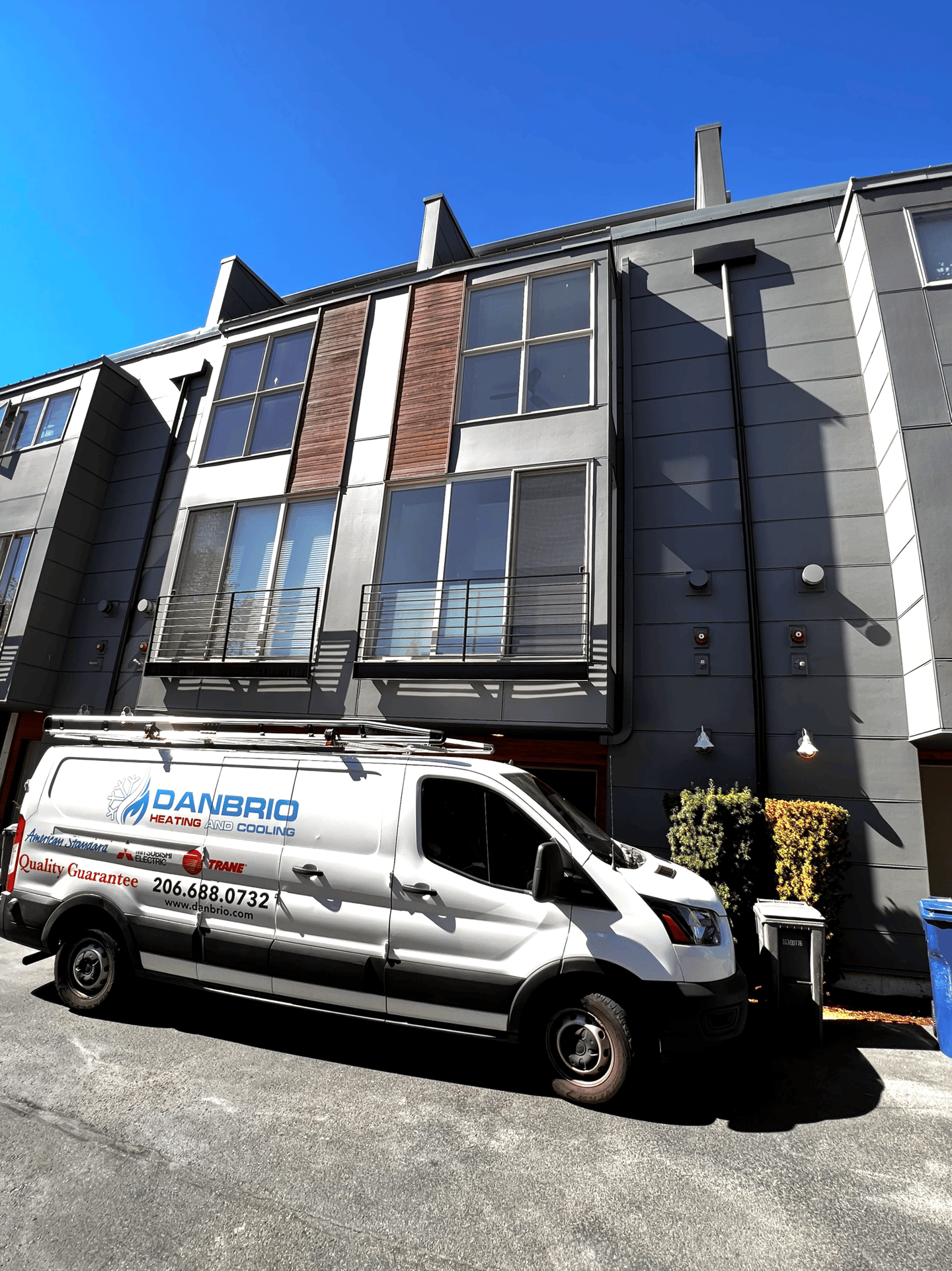 DANBRIO's Branded Van in front of a building visiting our client