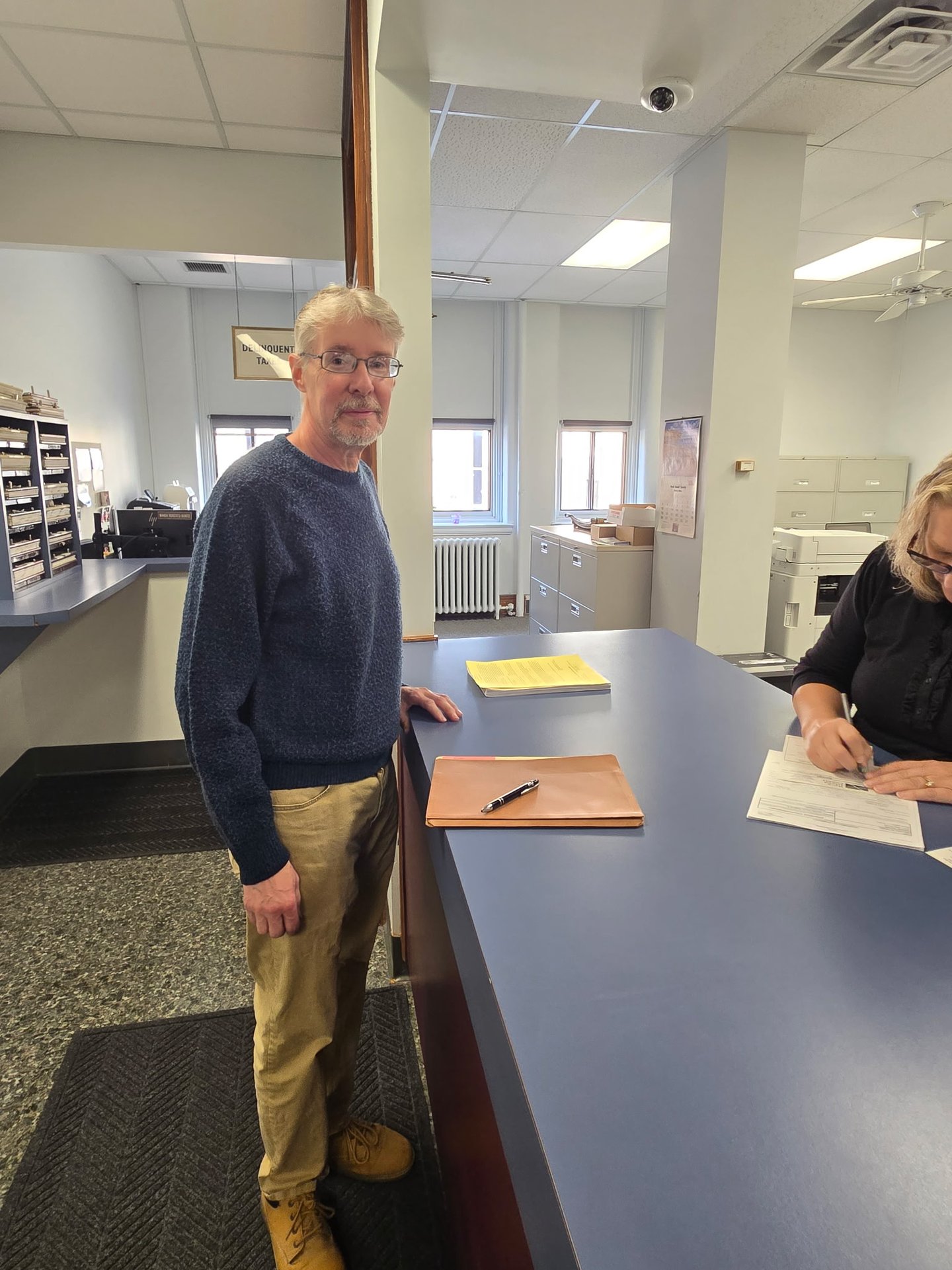Steven Rugh getting his petition checked in at the County Office