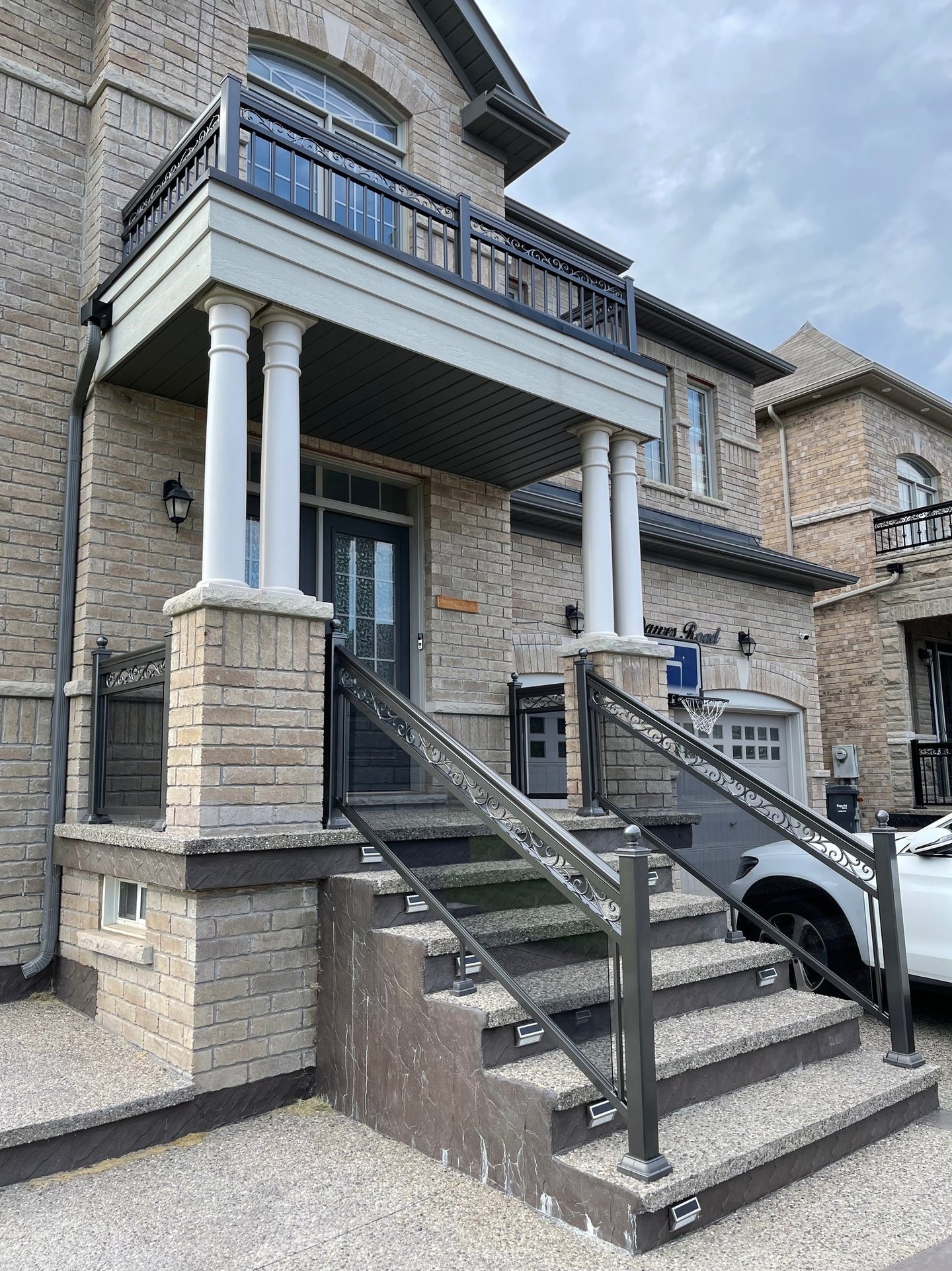 front stairway with grey tinted glass railings
