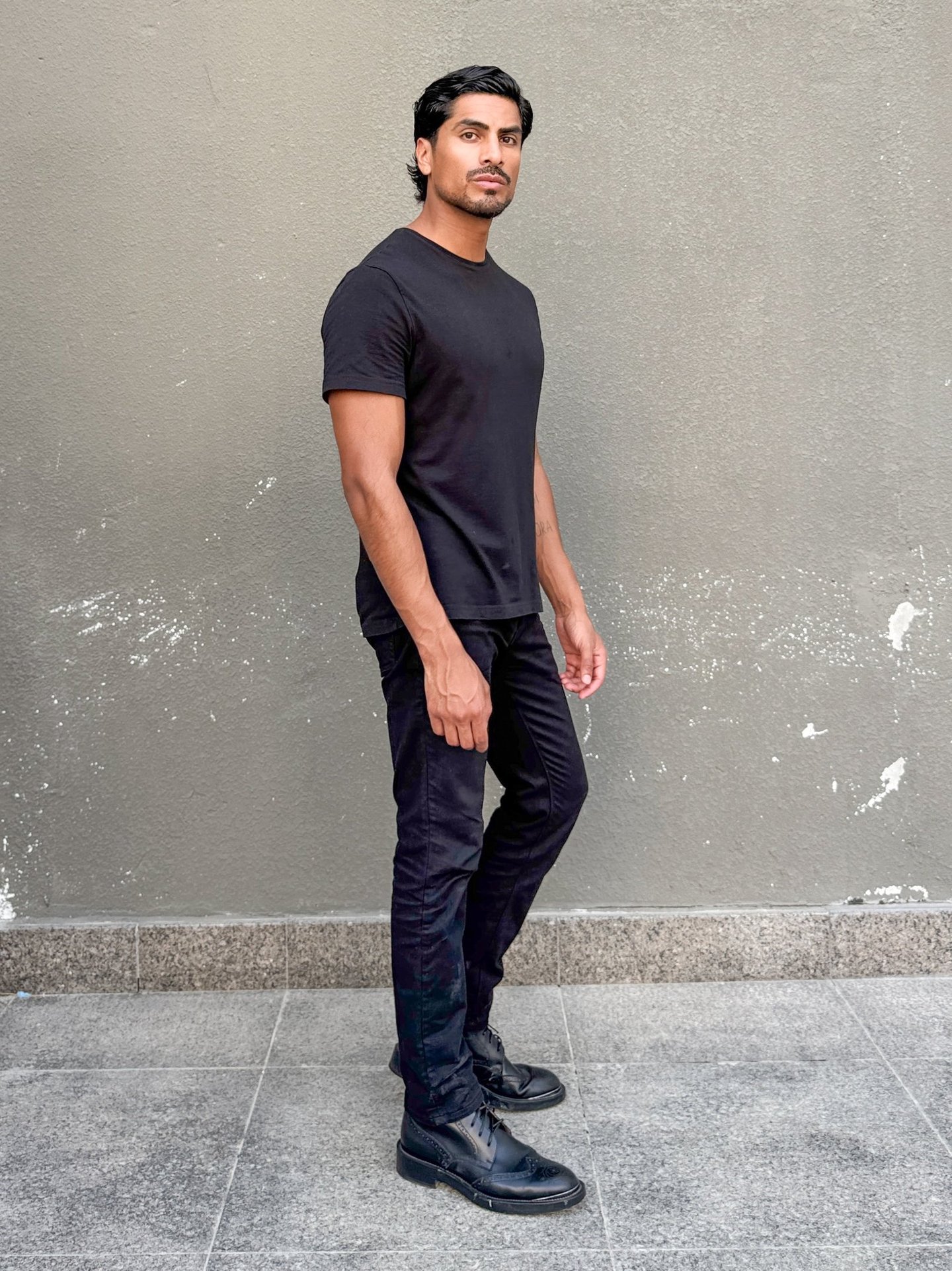 Dany Peña male model full body side polaroid for casting in Dubai