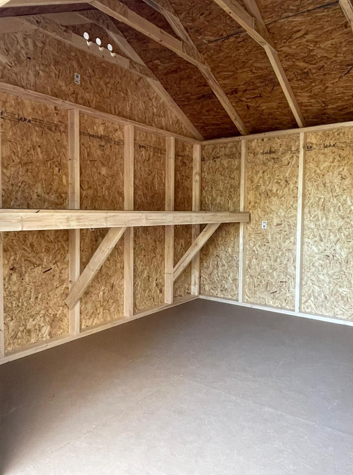 Custom shed with interior workbench built in Massachusetts and Rhode Island for added functionality.