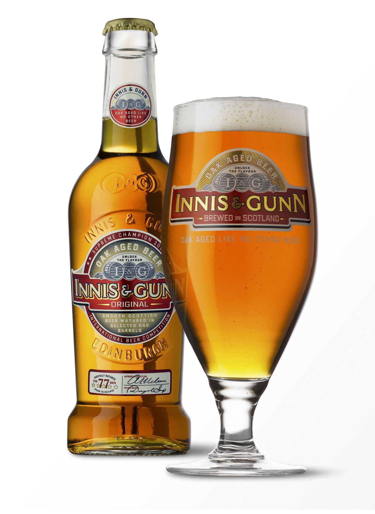  Beer bottle next to glass of beer both with Innis & Gunn logo on a white reflective background