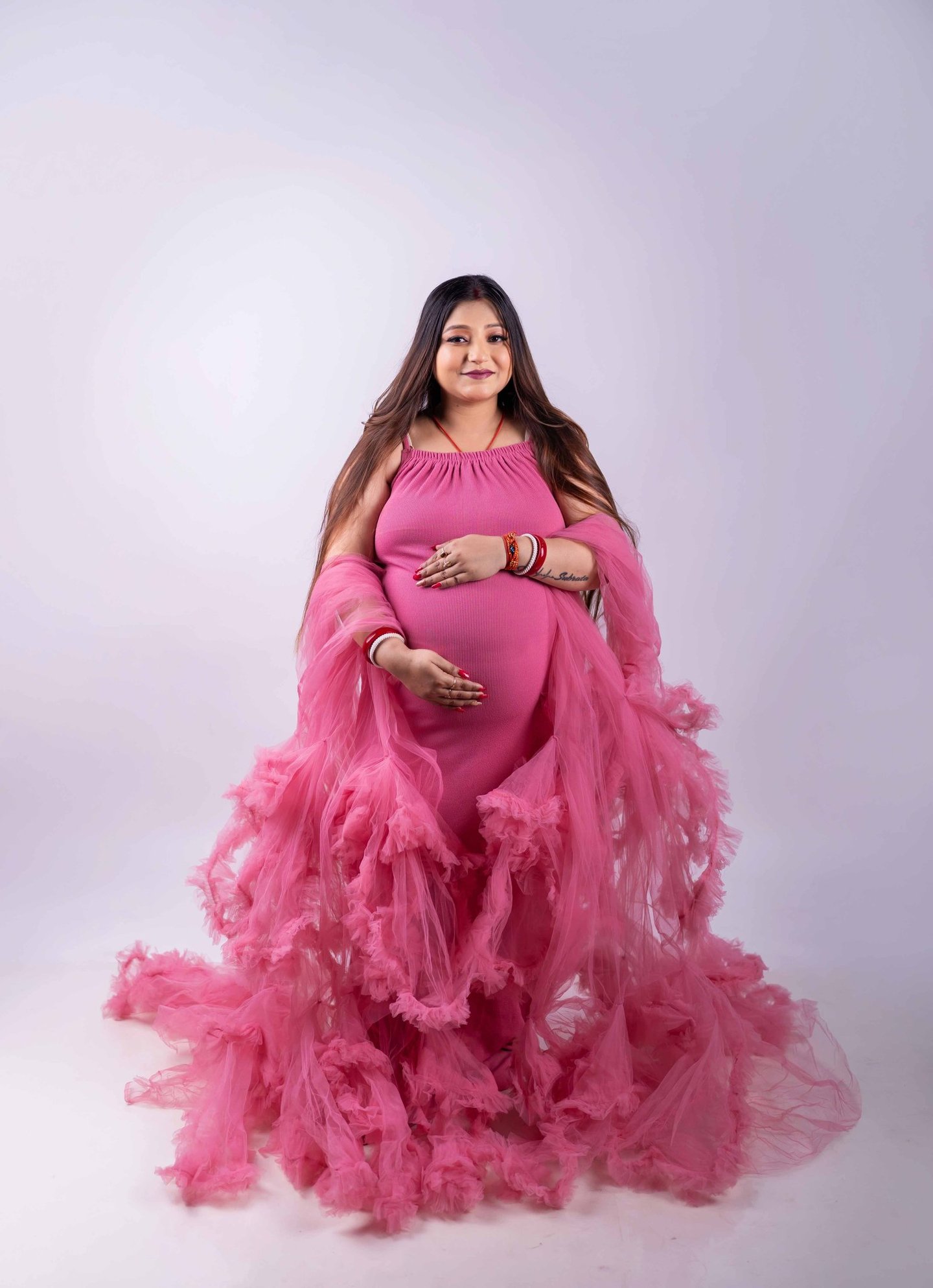 Elegant maternity portrait of an expecting mother at home in Kolkata
