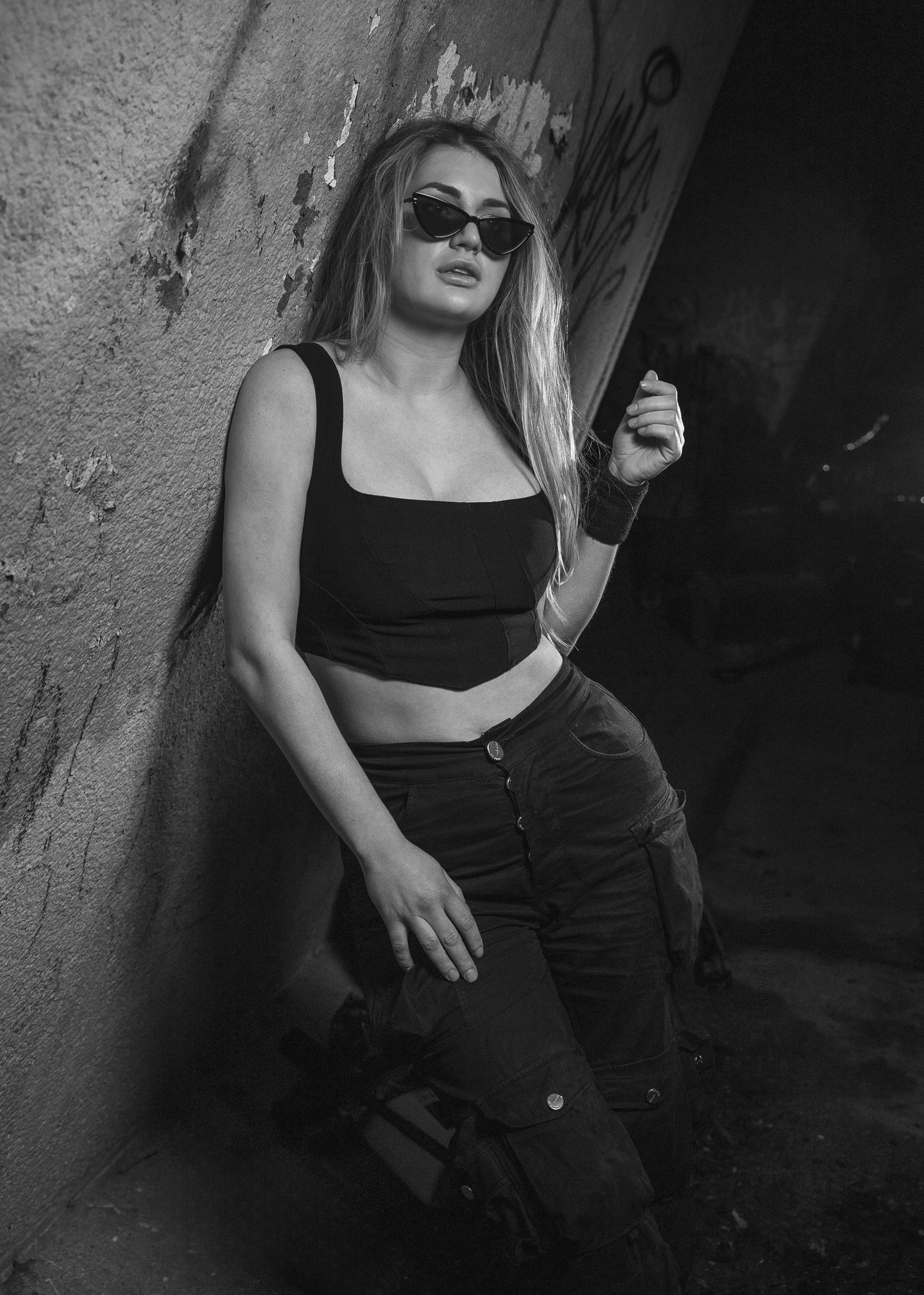 Dj Kat (Kat Bendis) in a photoshoot with black and white styling, wearing sunglasses