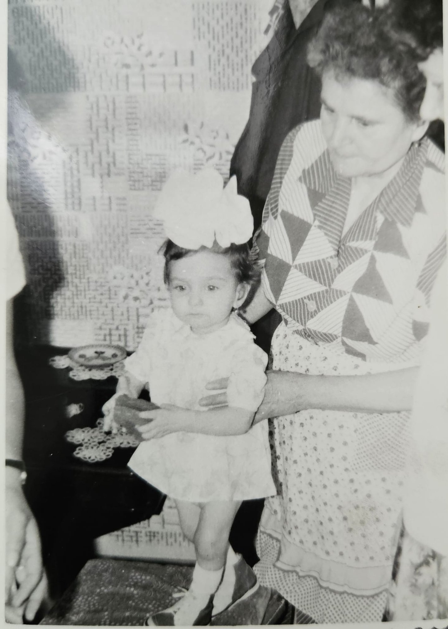 a woman holding a toddler 