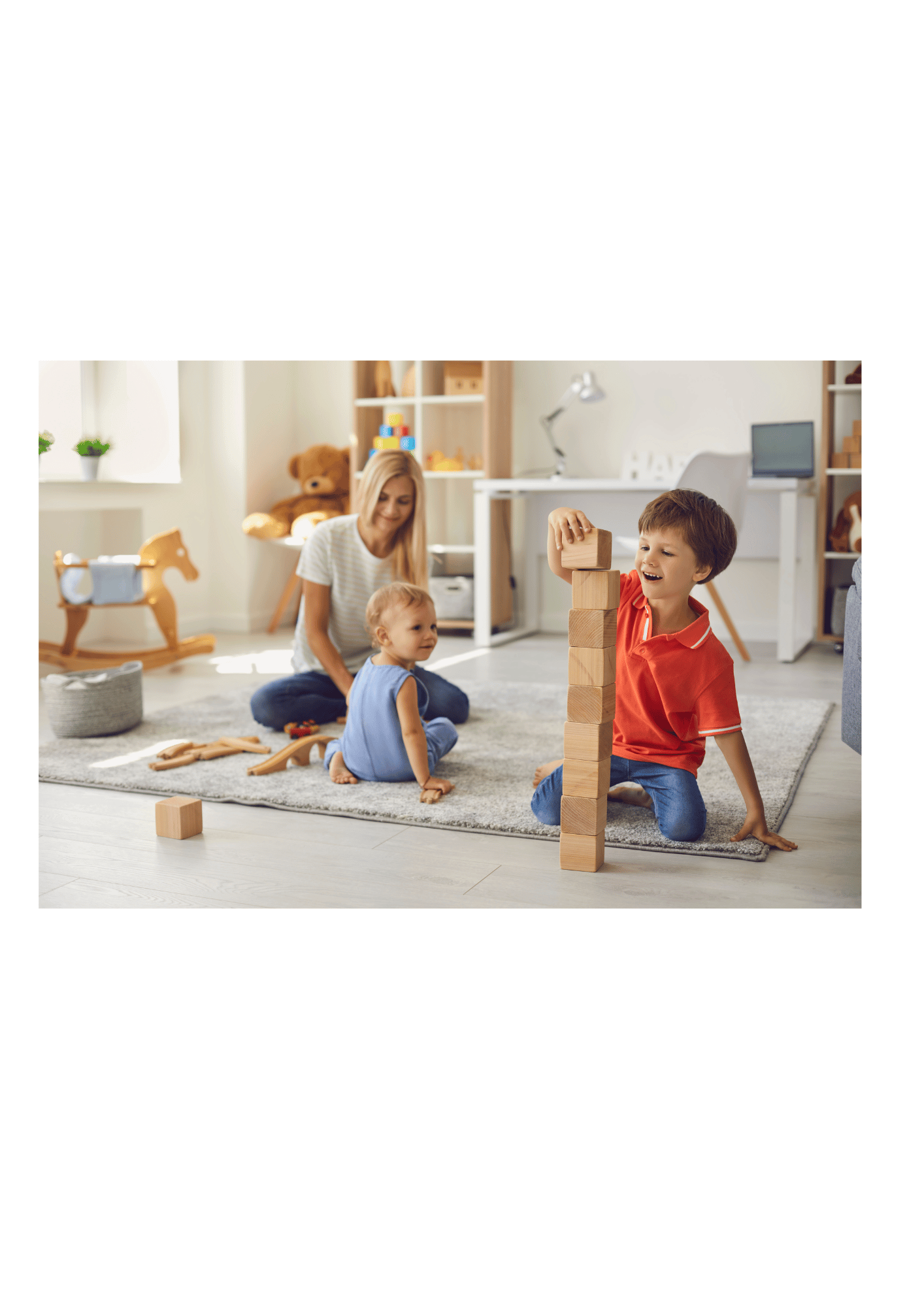 Mum and two young children playing with toys on the floor