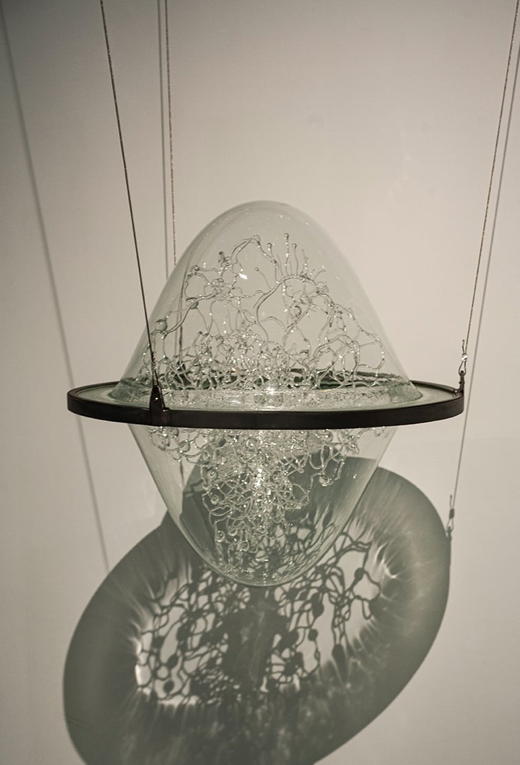 a glass sculpture in the air